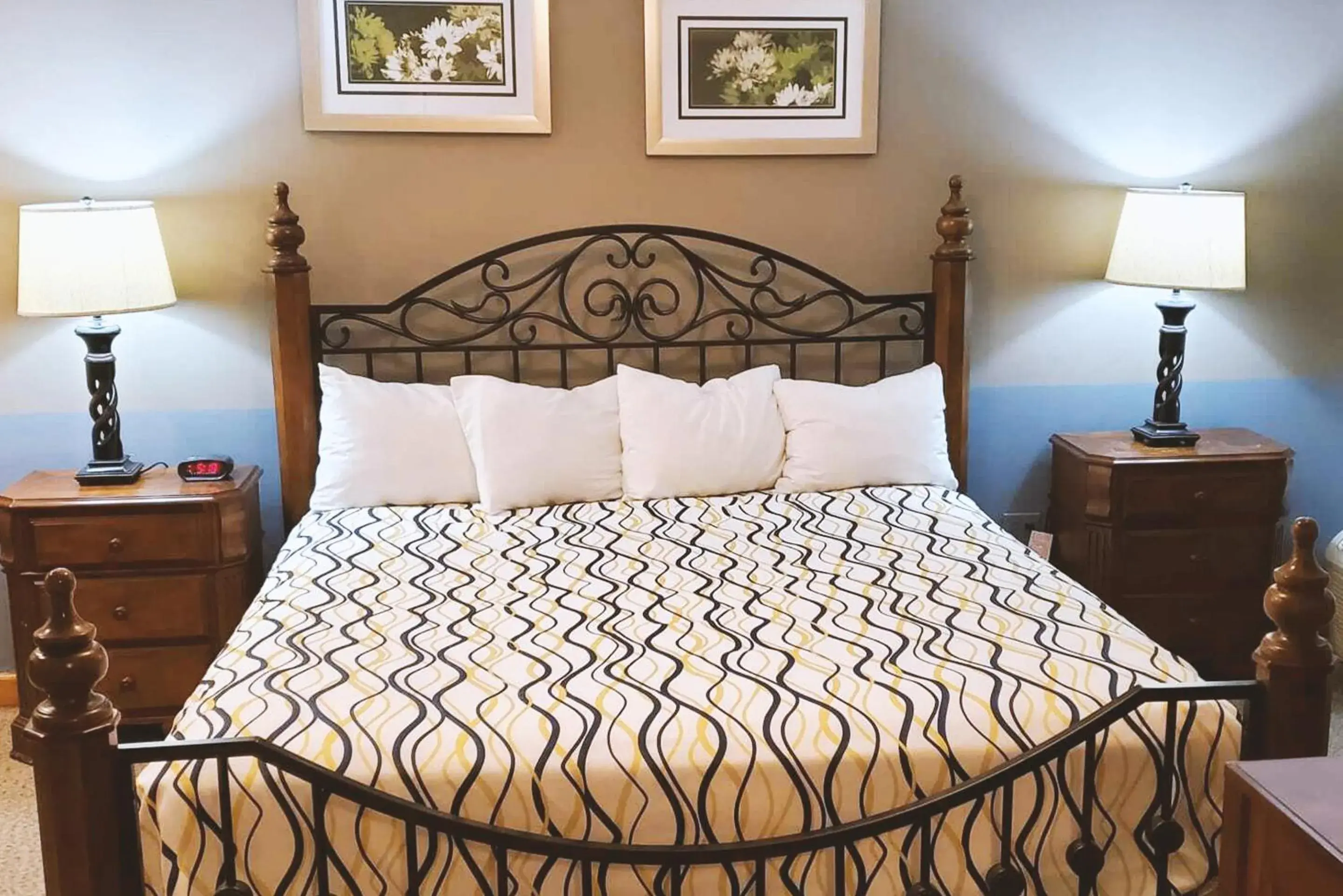 Bed in Coratel Inn & Suites by Jasper McCook