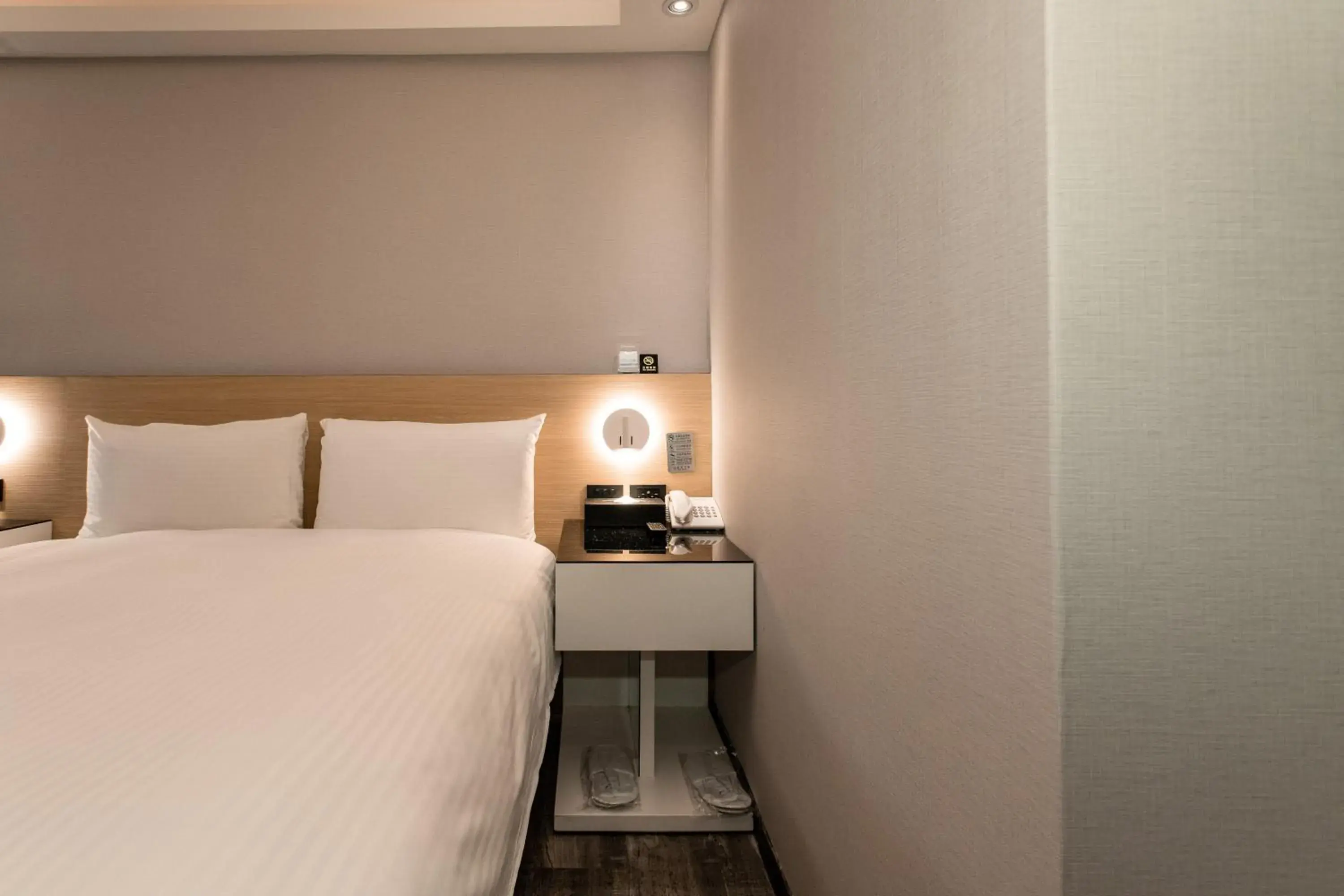 Bed in Hub Hotel Tucheng