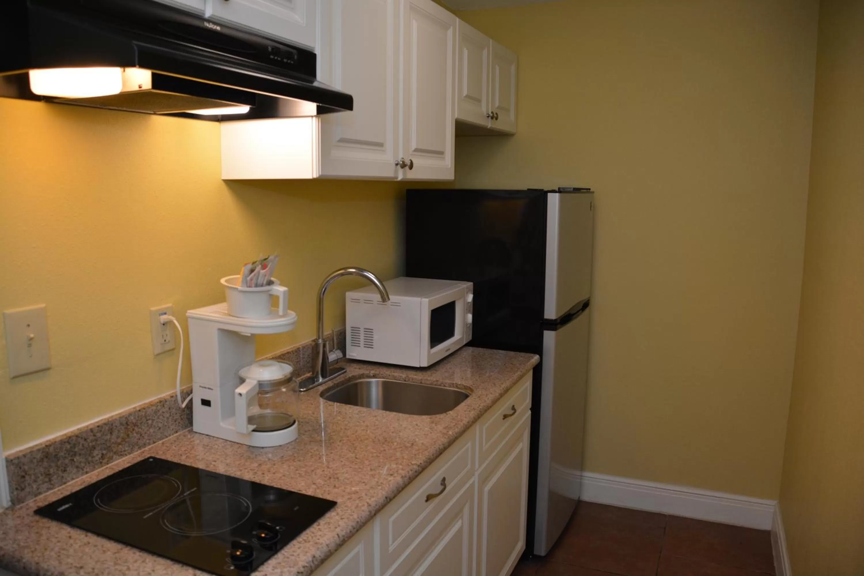 Kitchen or kitchenette in Ramada by Wyndham & Suites South Padre Island
