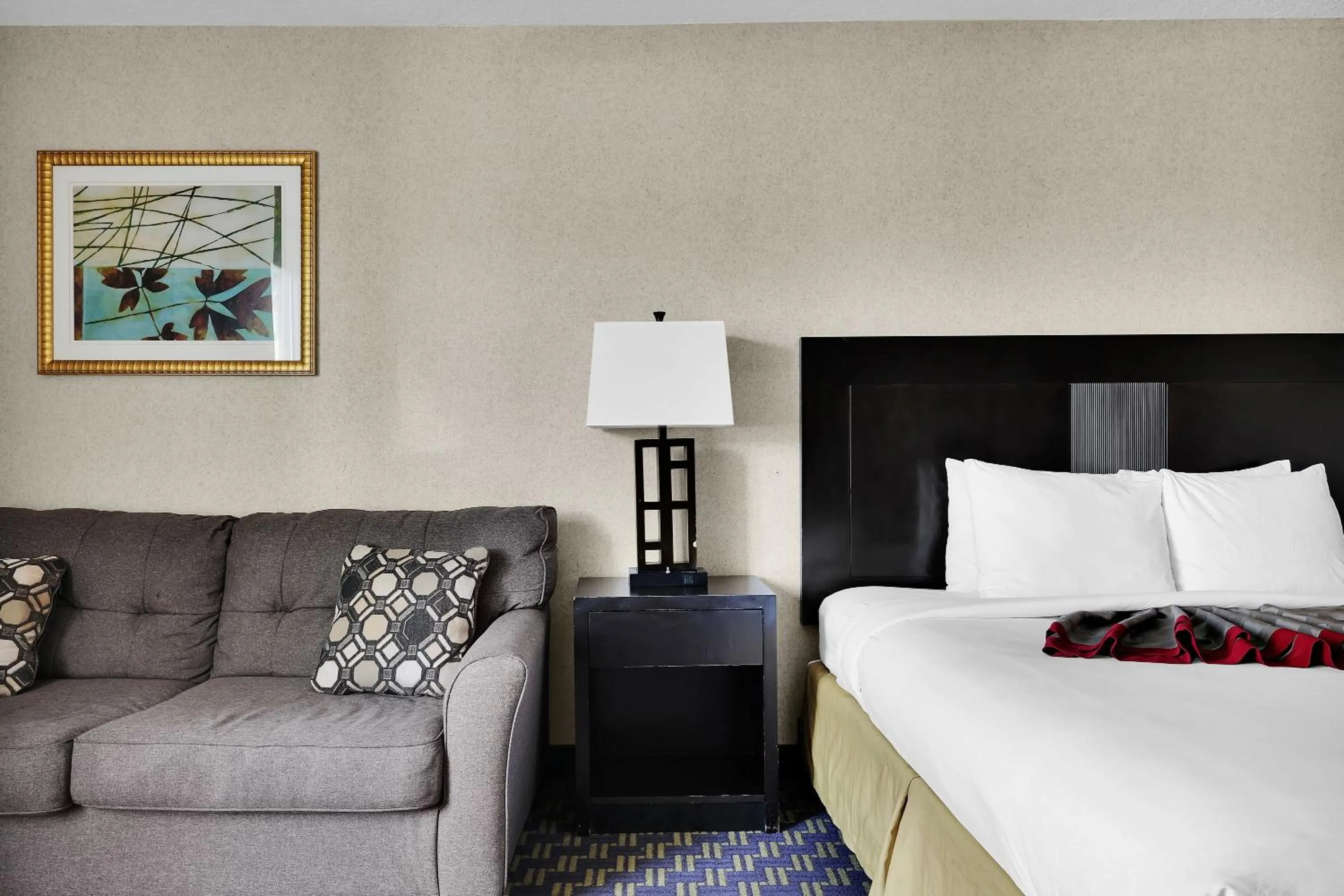 Bed in Ramada by Wyndham Jacksonville I-95 by Butler Blvd