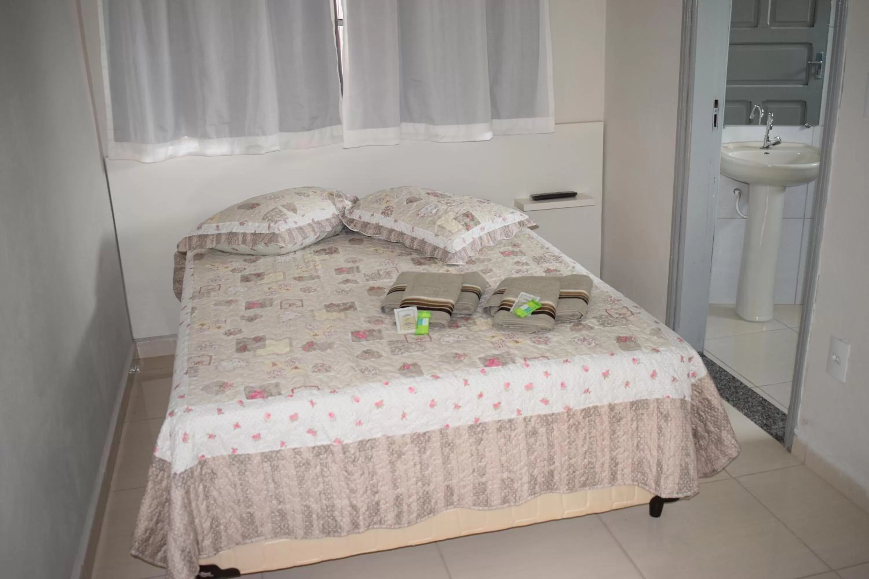 Bed in Pousada Araxá