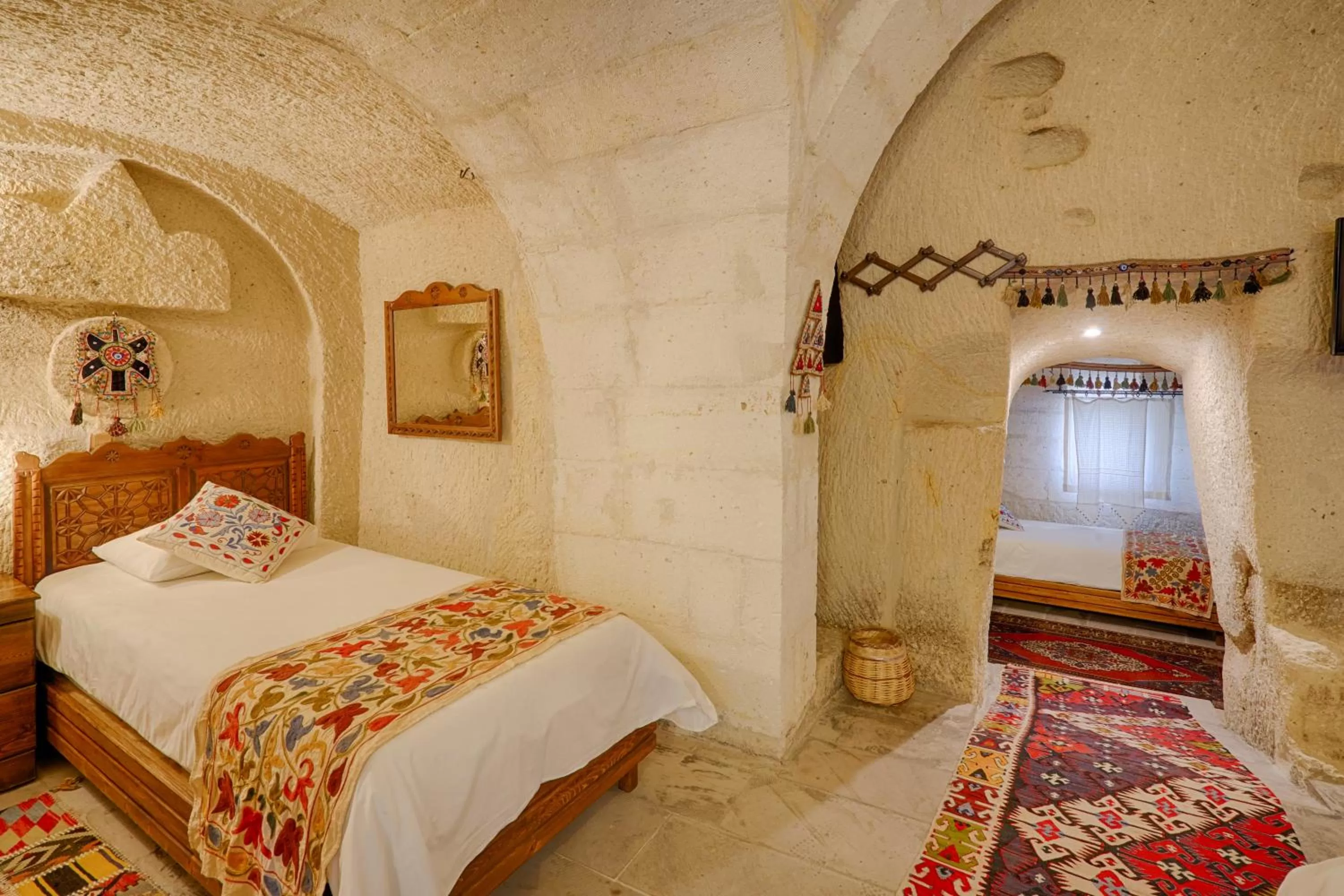 Bed in Tulip Cave Suites