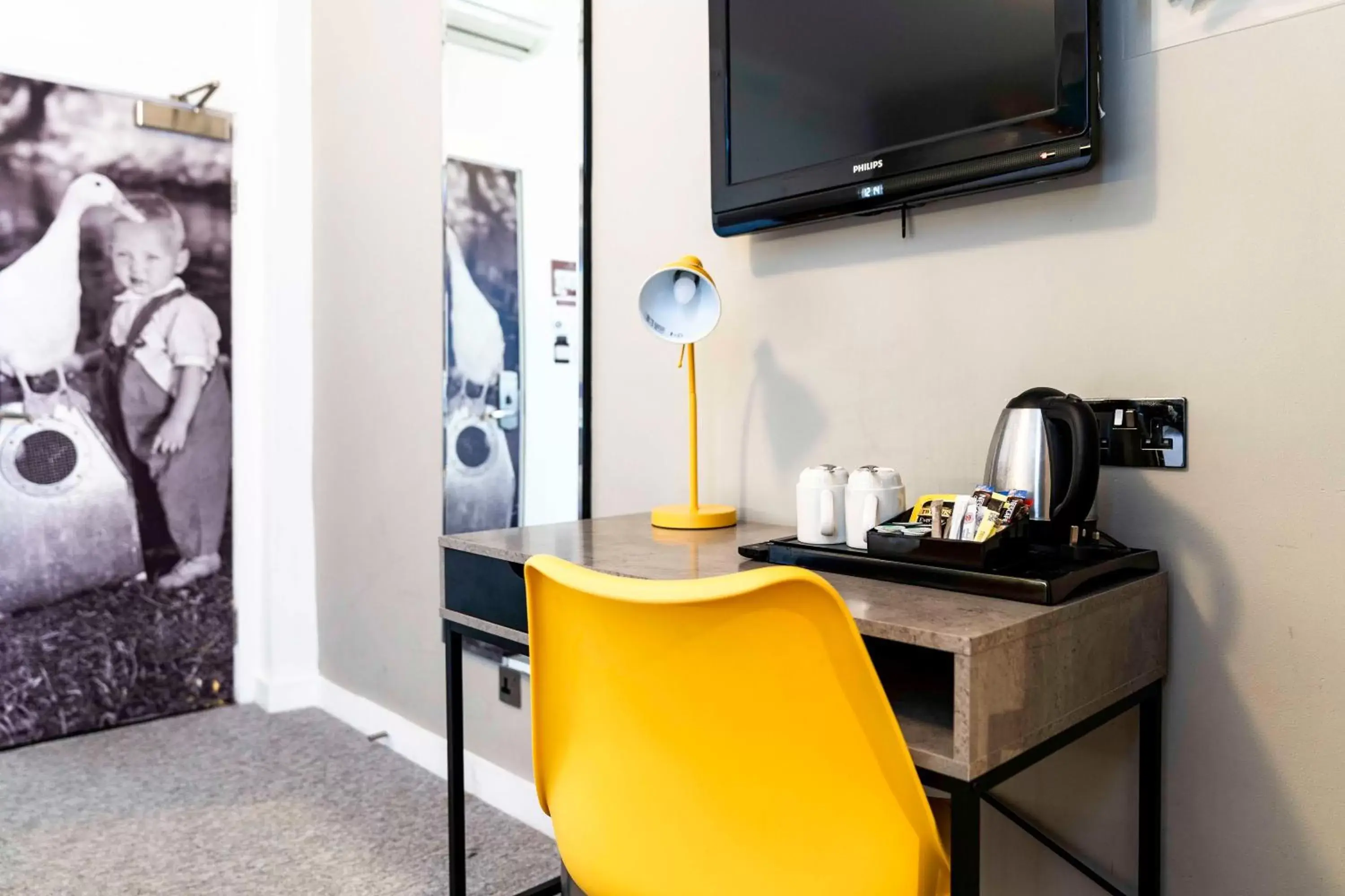 hair dresser, TV/Entertainment Center in Heeton Concept Hotel - Kensington London