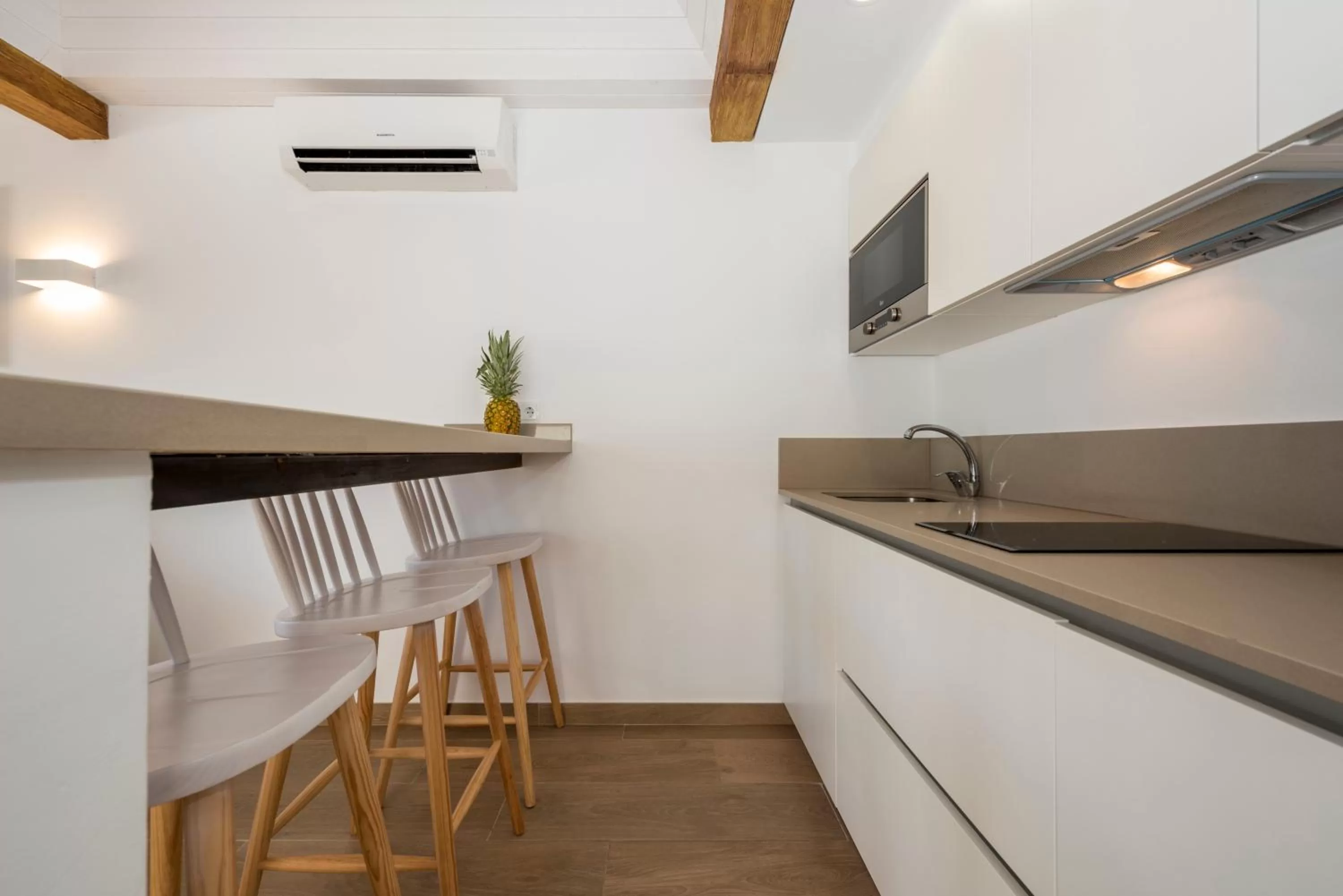 Kitchen or kitchenette in Camelina Suites