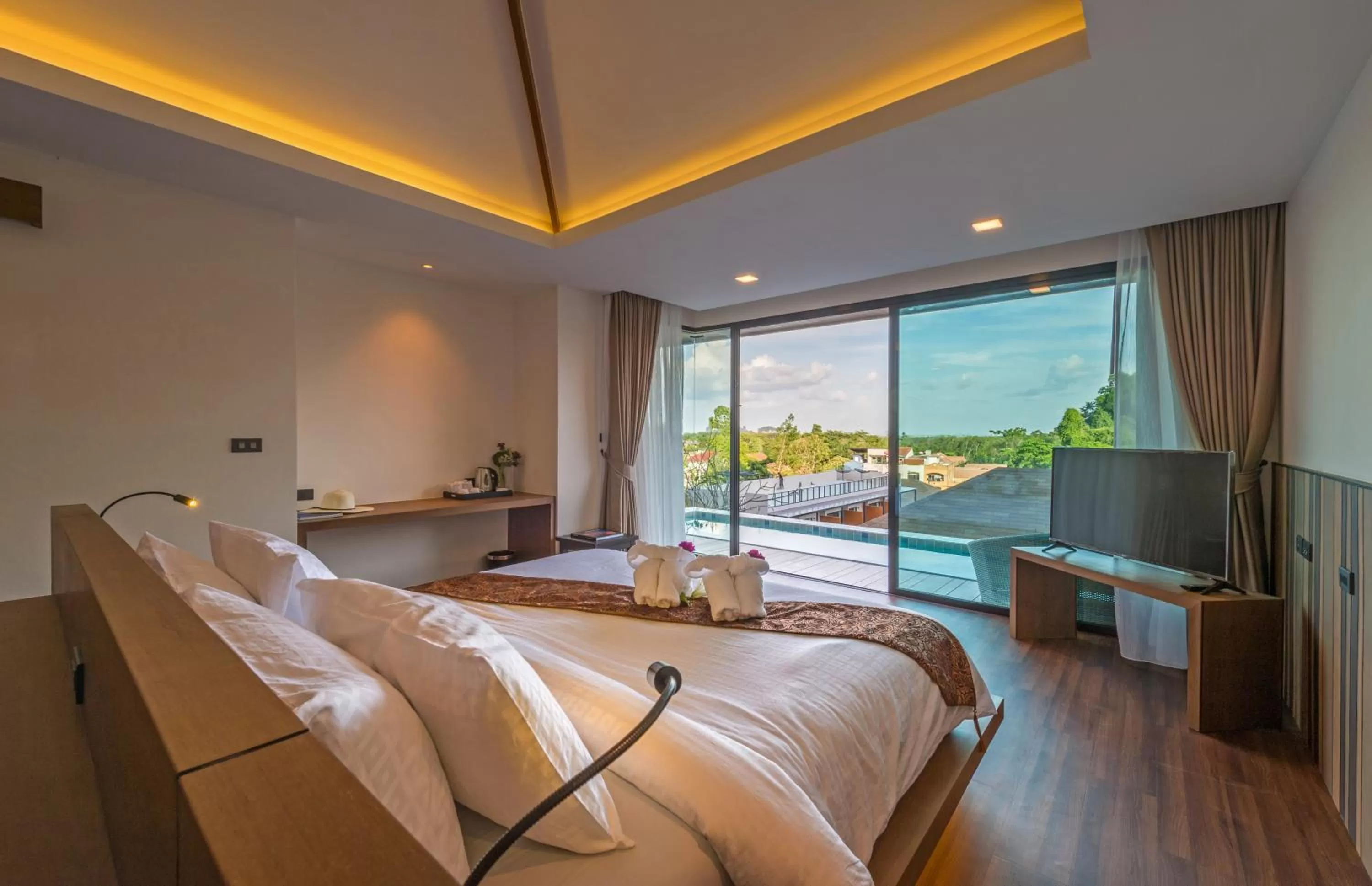 Bed in Cher​mantra​ Aonang​ Resort & Pool​ Suite