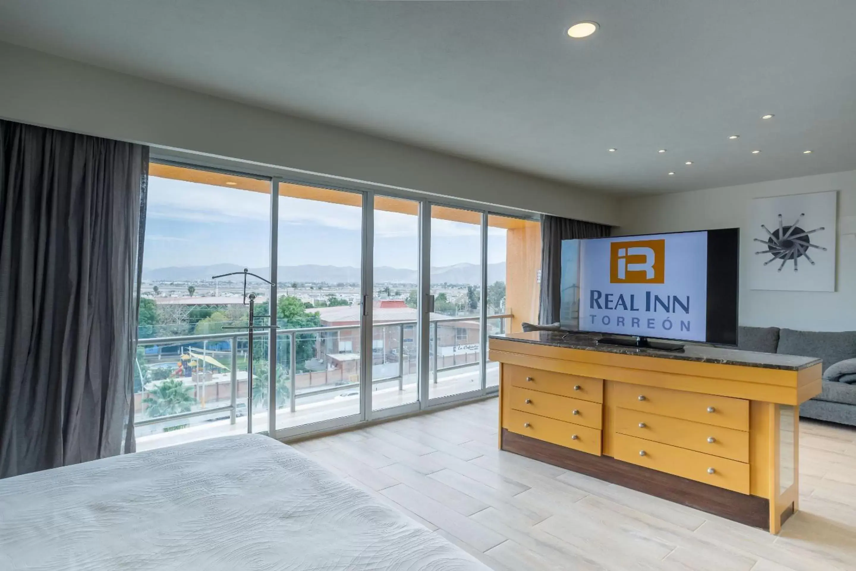 Photo of the whole room, TV/Entertainment Center in Real Inn Torreon