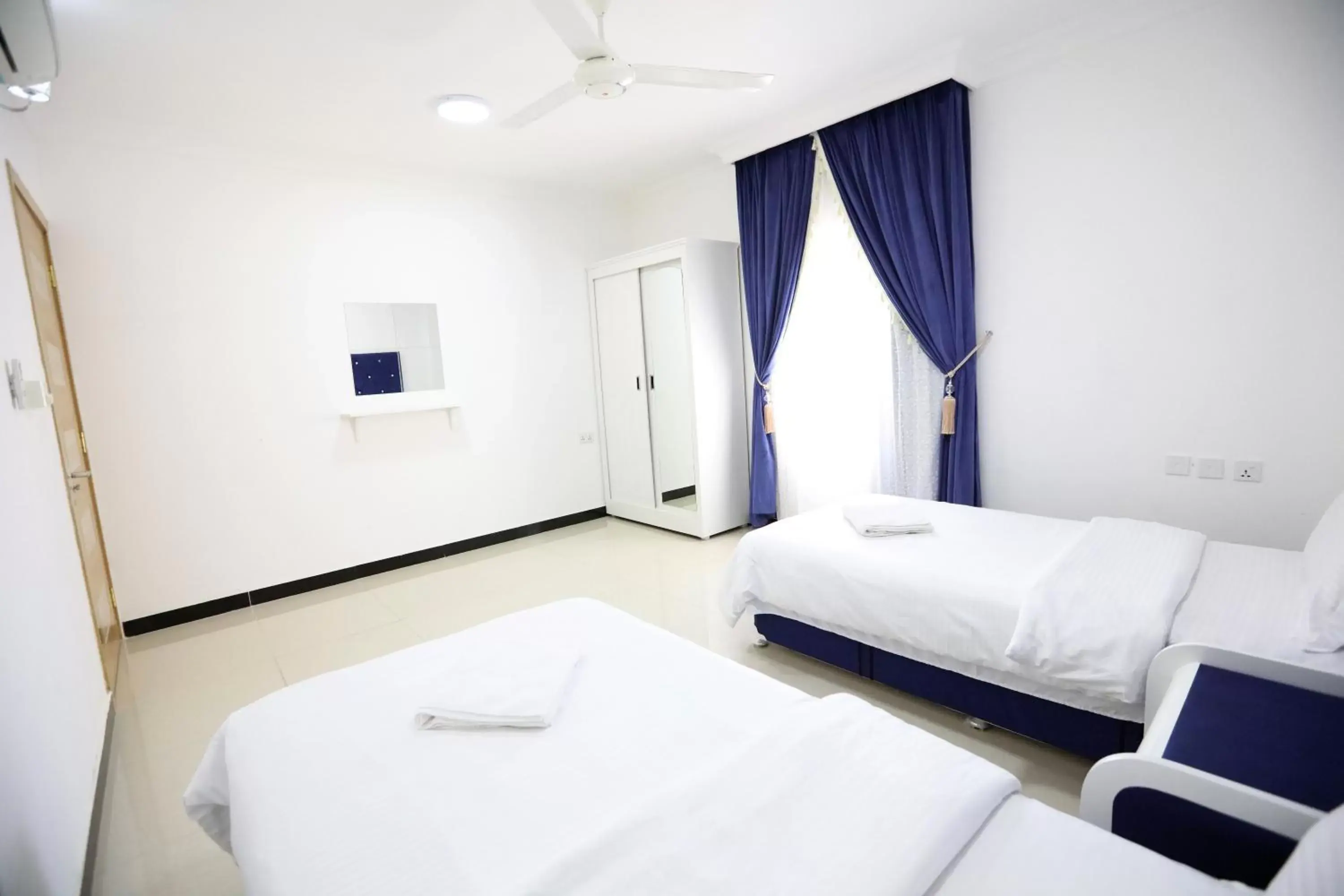 Bed in Al Rayyan Hotel Apartments Muscat