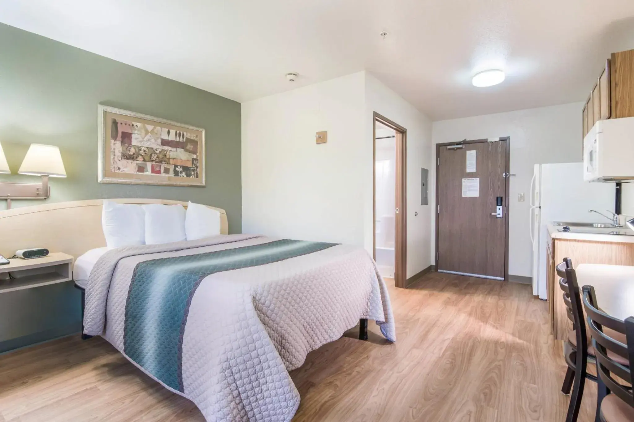 Photo of the whole room, Bed in HomeTowne Studios & Suites by Red Roof Bentonville