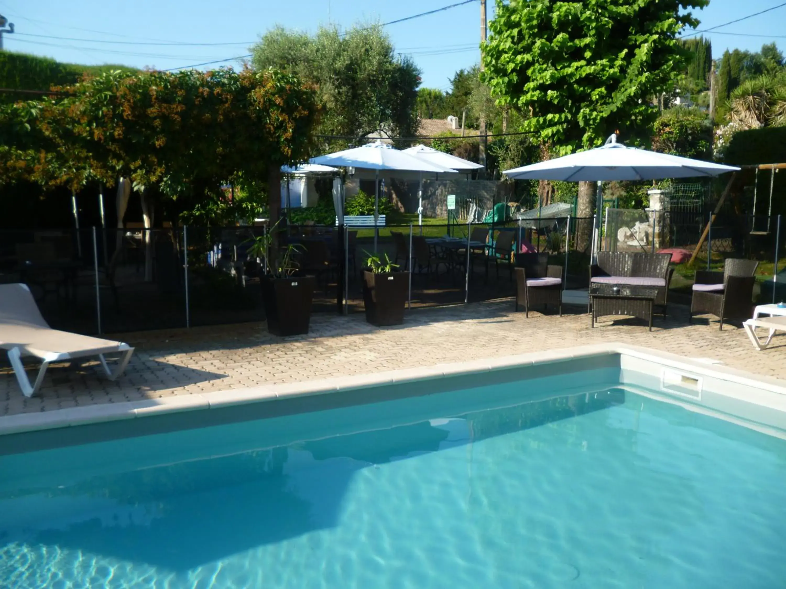 Swimming Pool in Logis Hotel des Cayrons