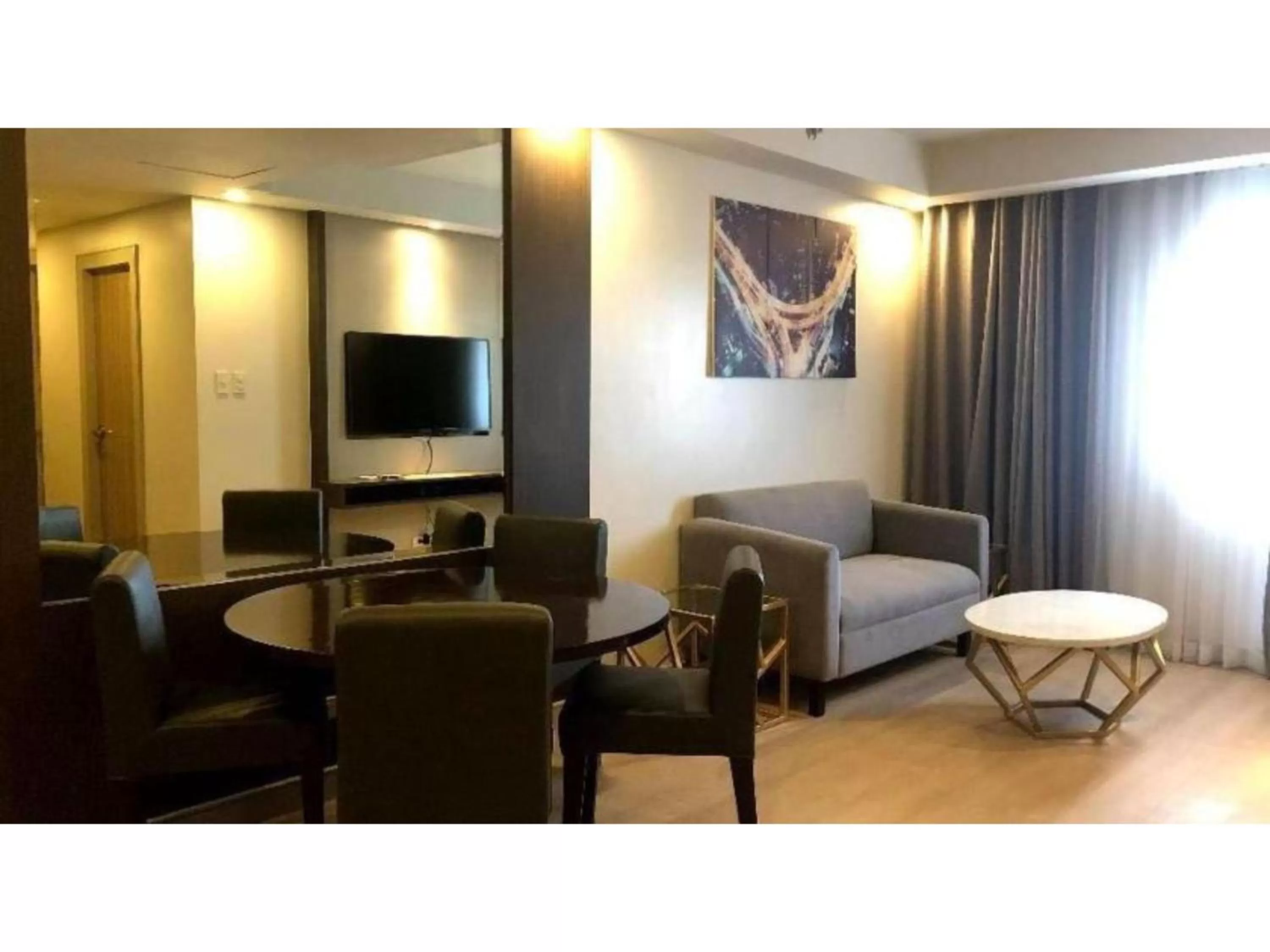 Living room, Seating Area in Capital O 804 The Residences at Bonifacio Civic Center