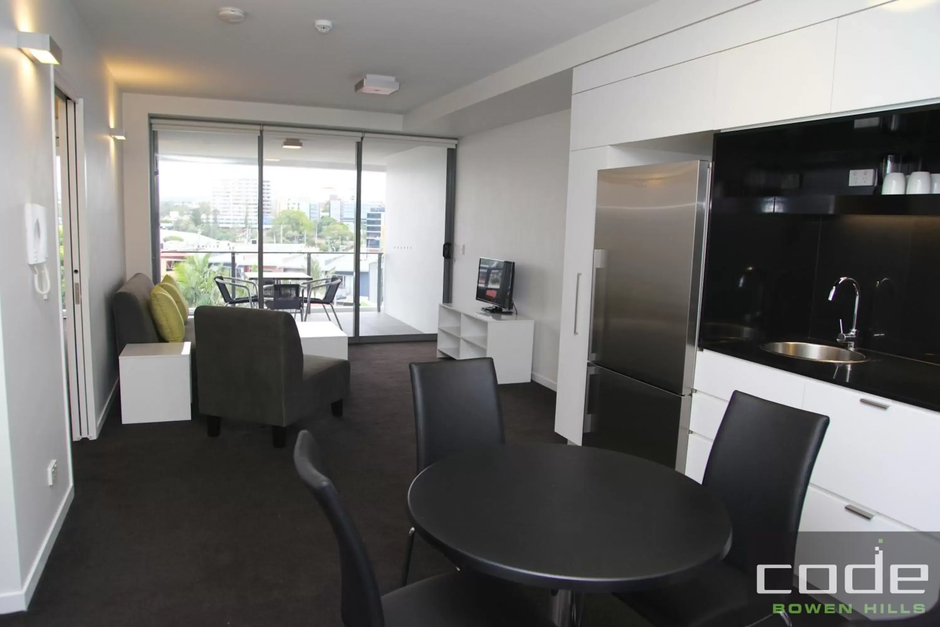 Living room, Dining Area in Code Apartments