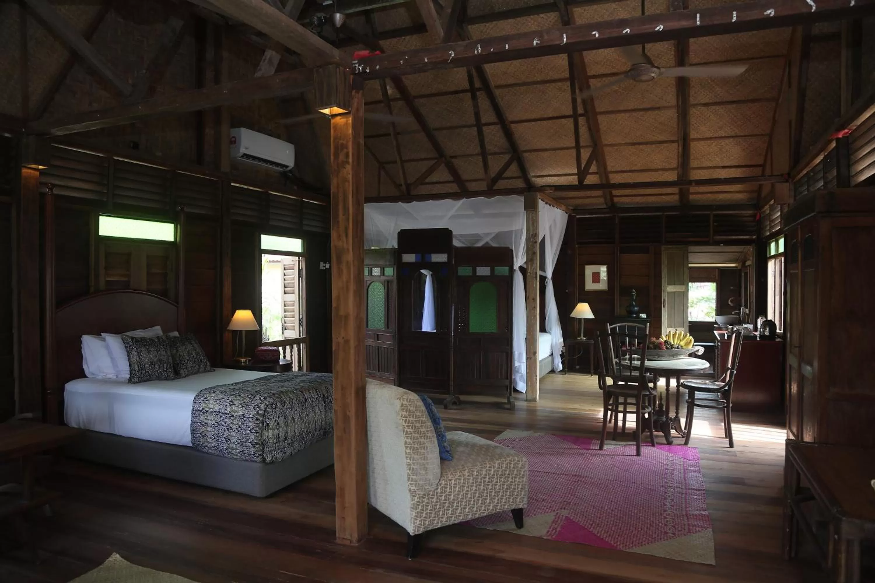 Bed in Kunang Kunang Heritage Villas