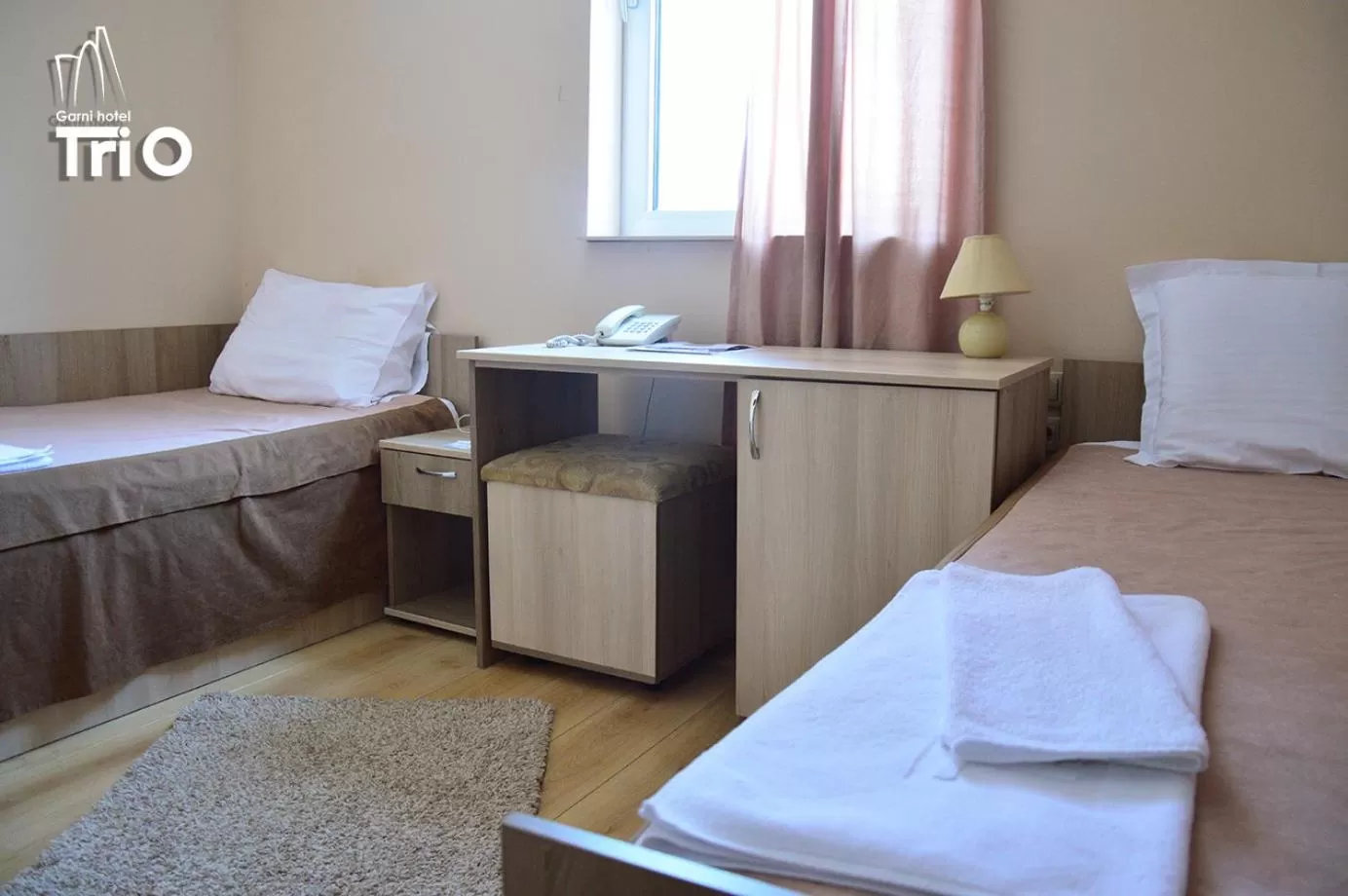 Bed in Garni Hotel Tri O