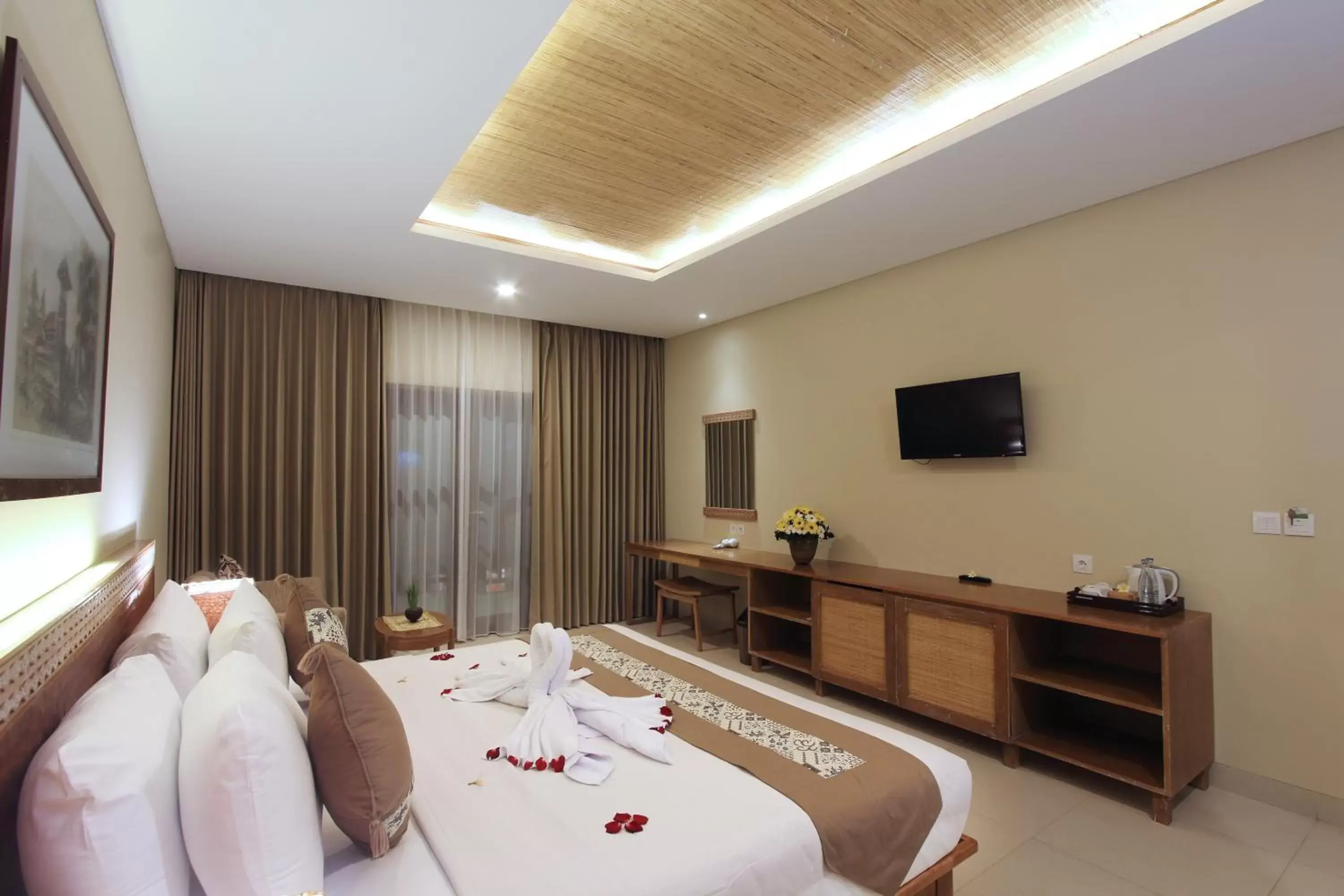 Photo of the whole room, TV/Entertainment Center in Radha Phala Resort & Spa