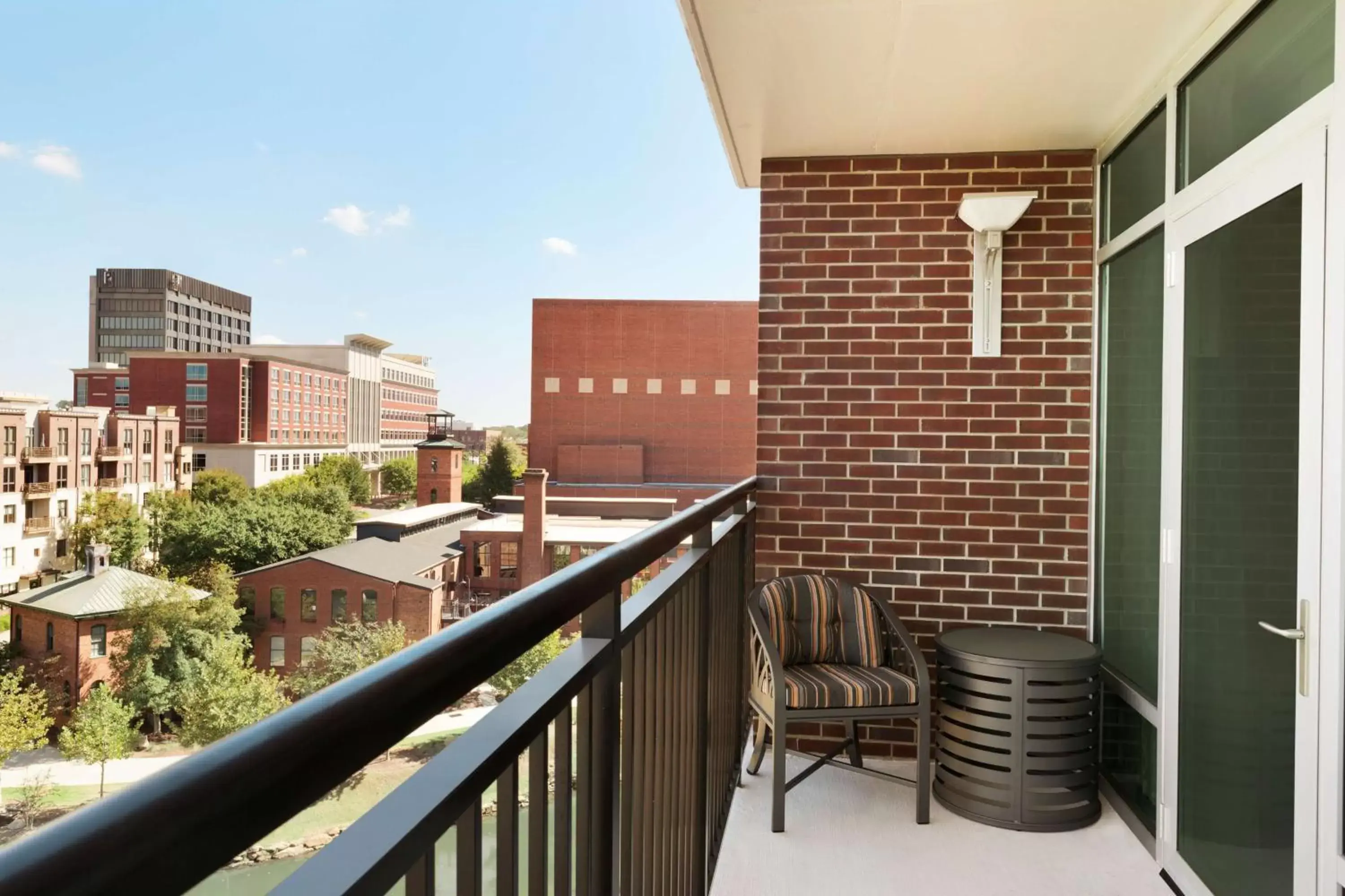 Bed, Balcony/Terrace in Embassy Suites by Hilton Greenville Downtown Riverplace