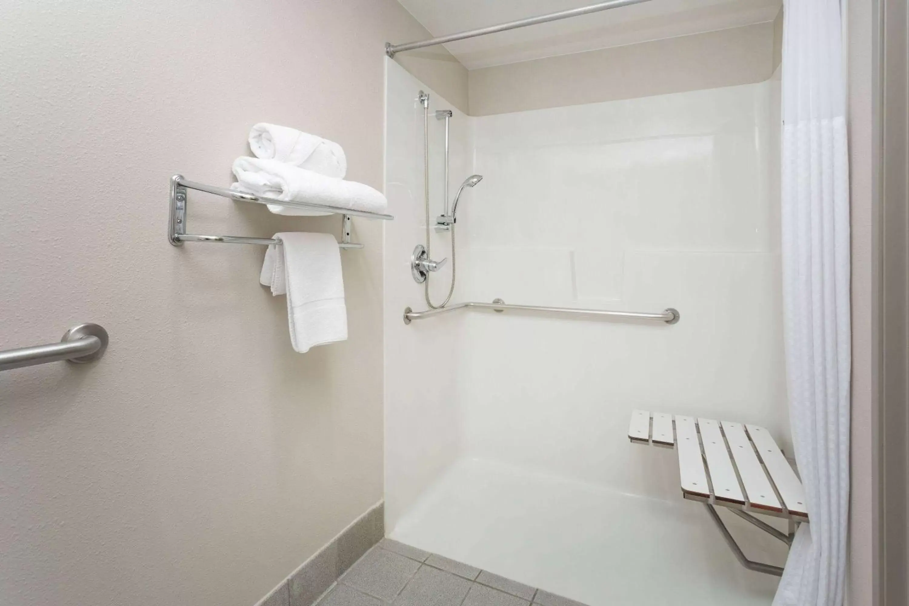 Shower, Bathroom in Days Inn & Suites by Wyndham Denver International Airport