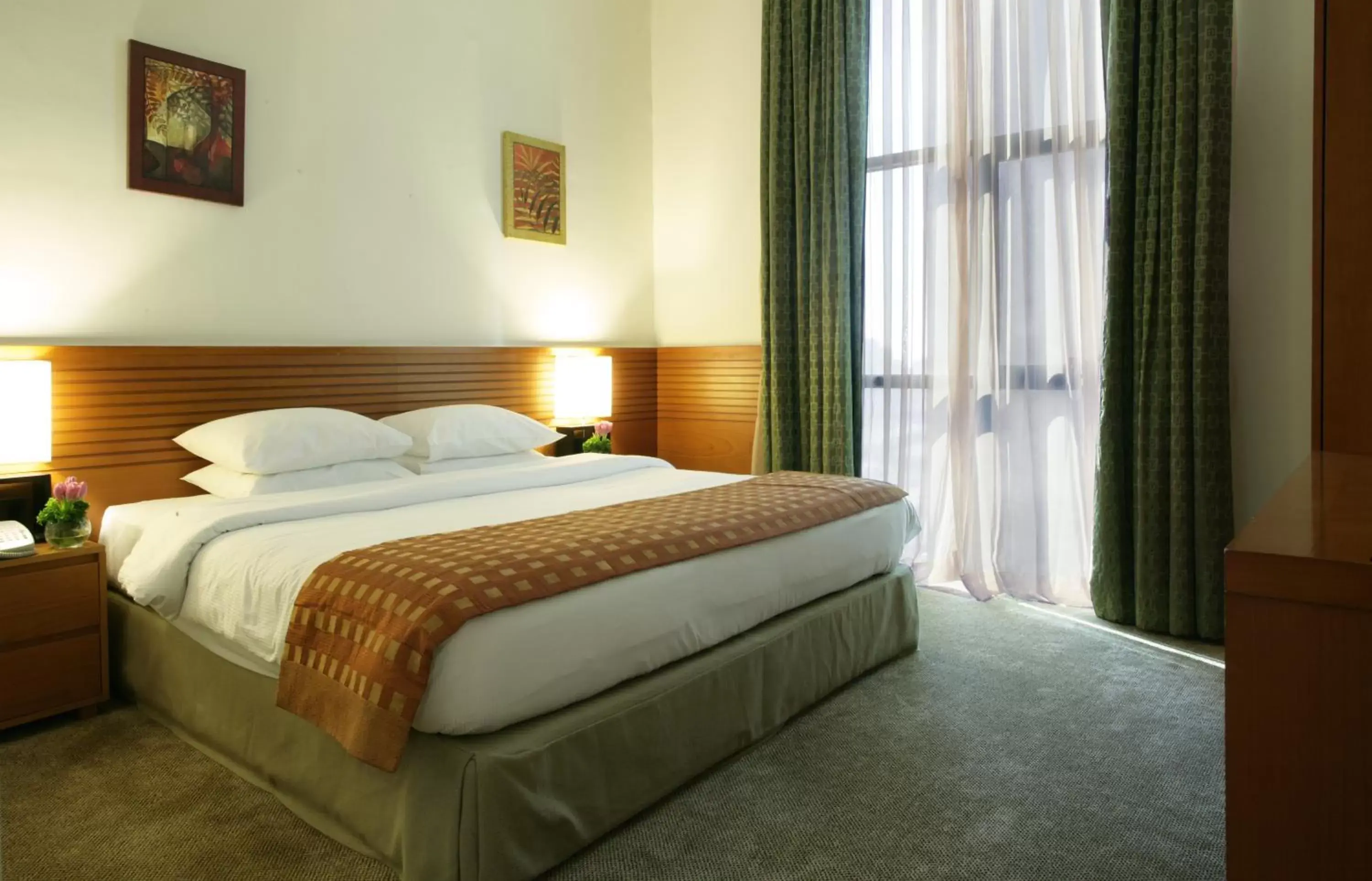 Bed in Ramada Hotel & Suites by Wyndham Ajman