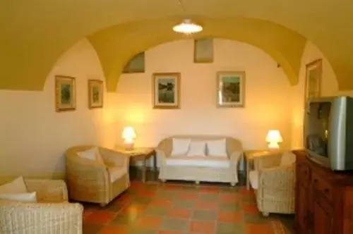 Communal lounge/ TV room, Bed in Corte Fiorita Albergo Diffuso