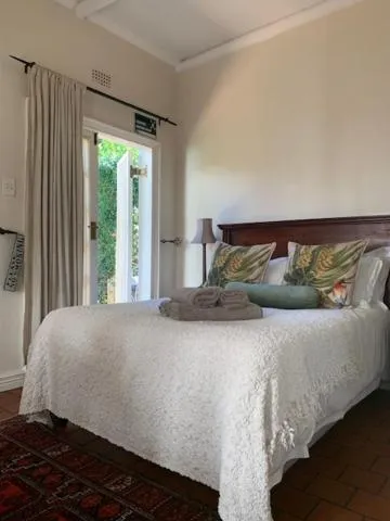 Bed in A Tapestry Garden Guest House