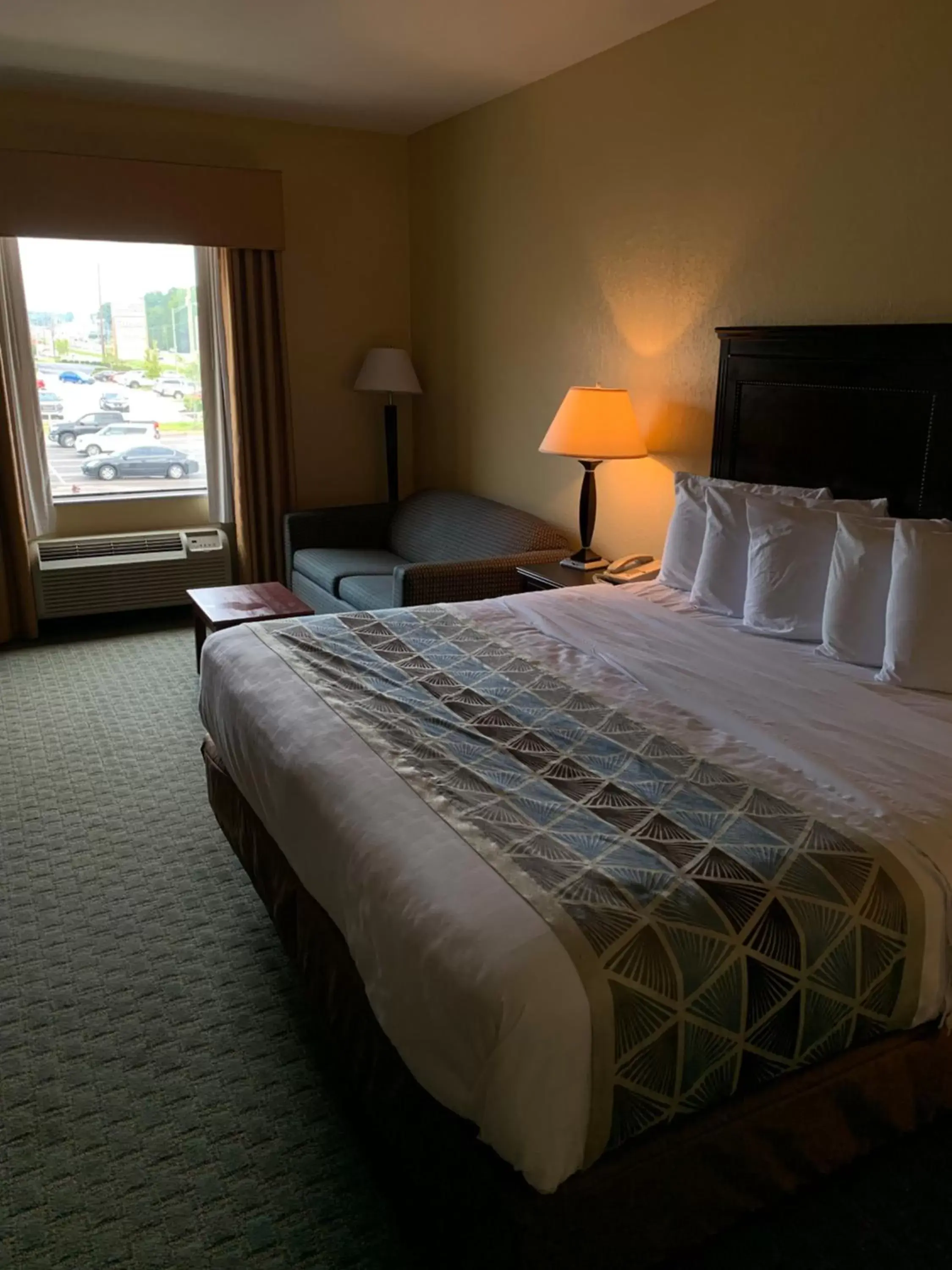 Bed in Ambassador Inn & Suites