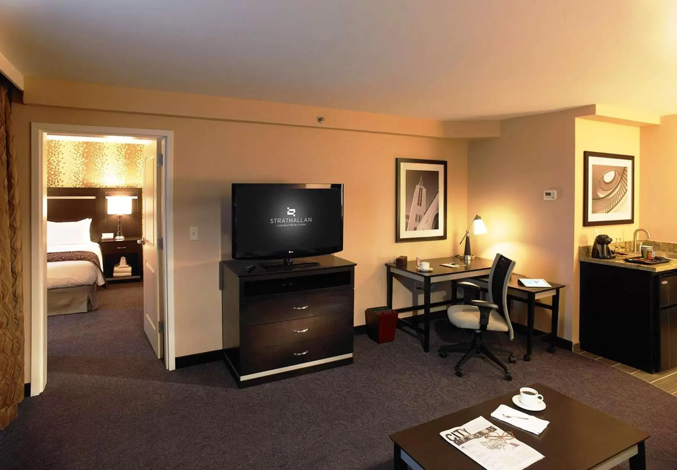 Living room, TV/Entertainment Center in The Strathallan - a DoubleTree by Hilton