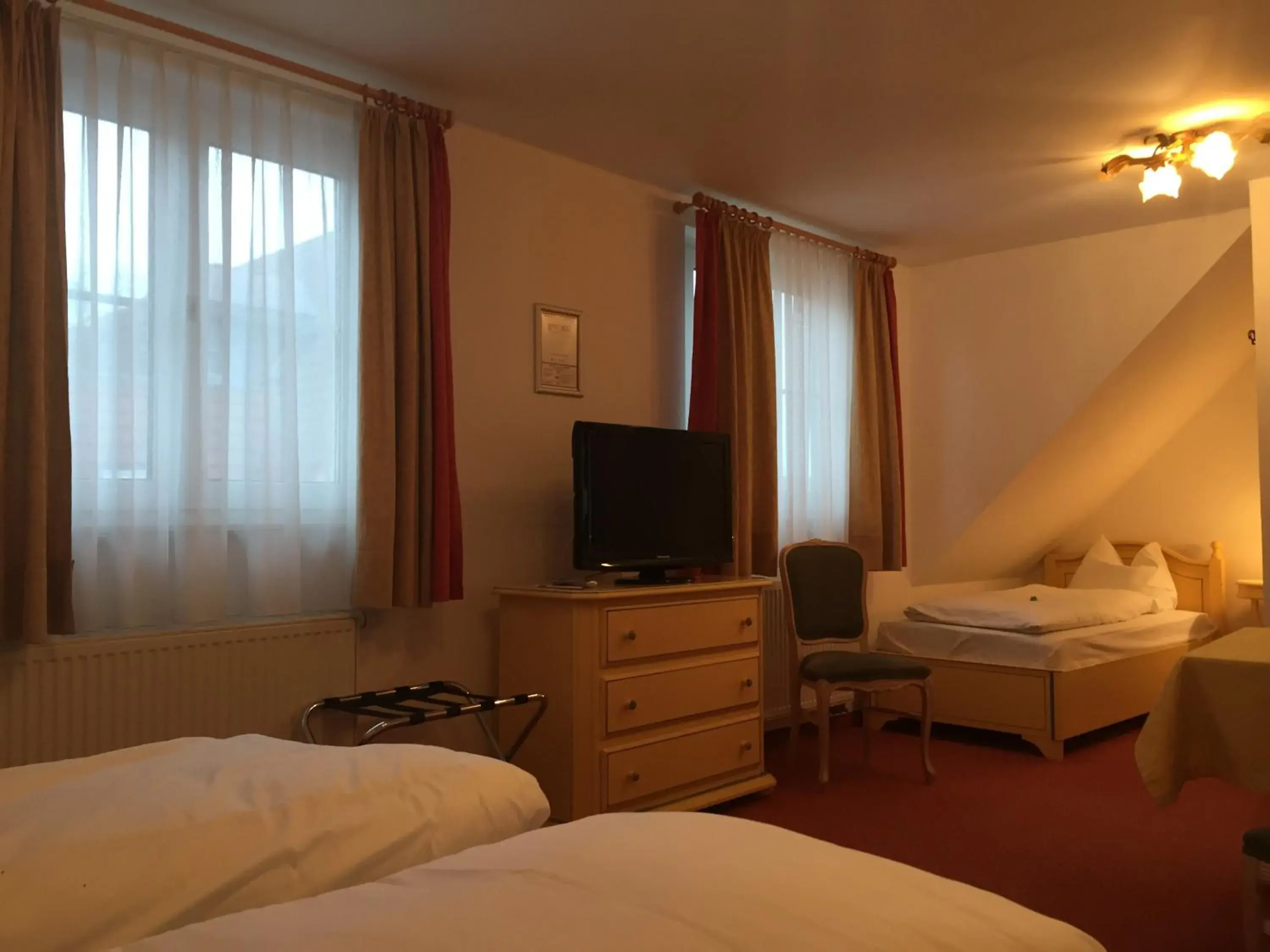 Photo of the whole room, Bed in Flair Hotel Vier Jahreszeiten