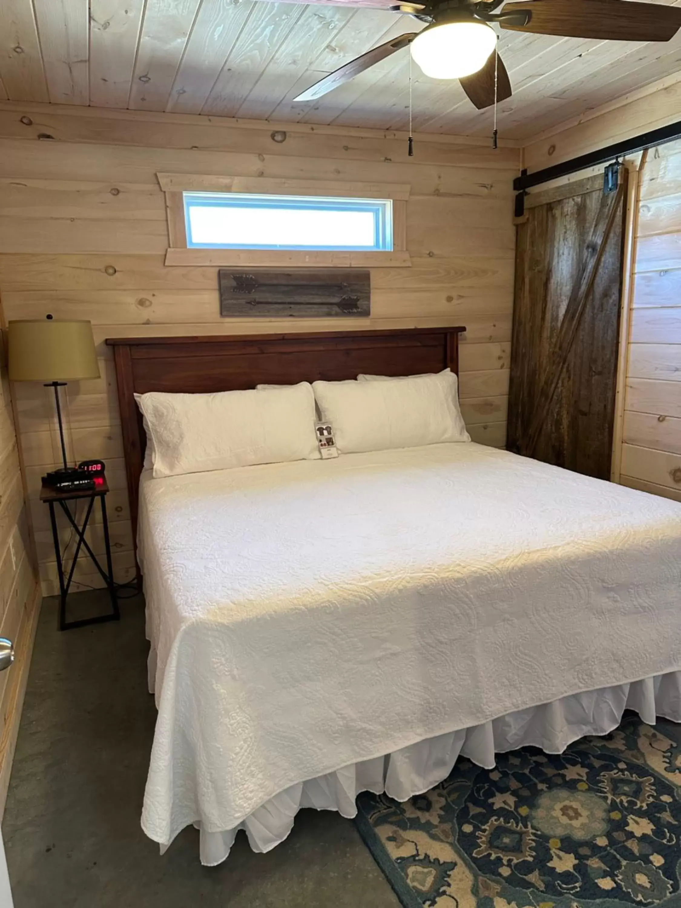 Bed in Knotty Squirrel Cabins