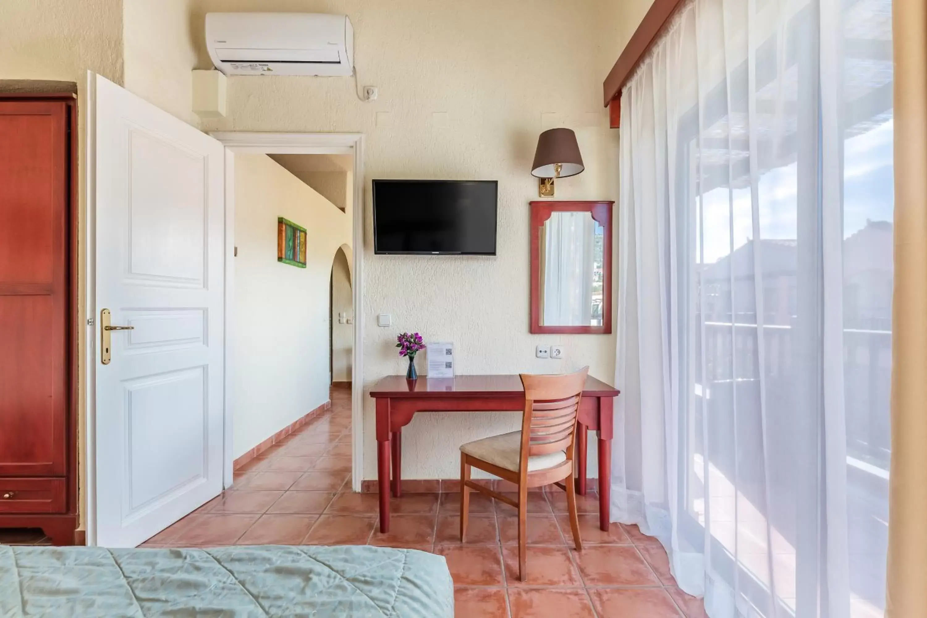 Bedroom, TV/Entertainment Center in Rigas Hotel Skopelos