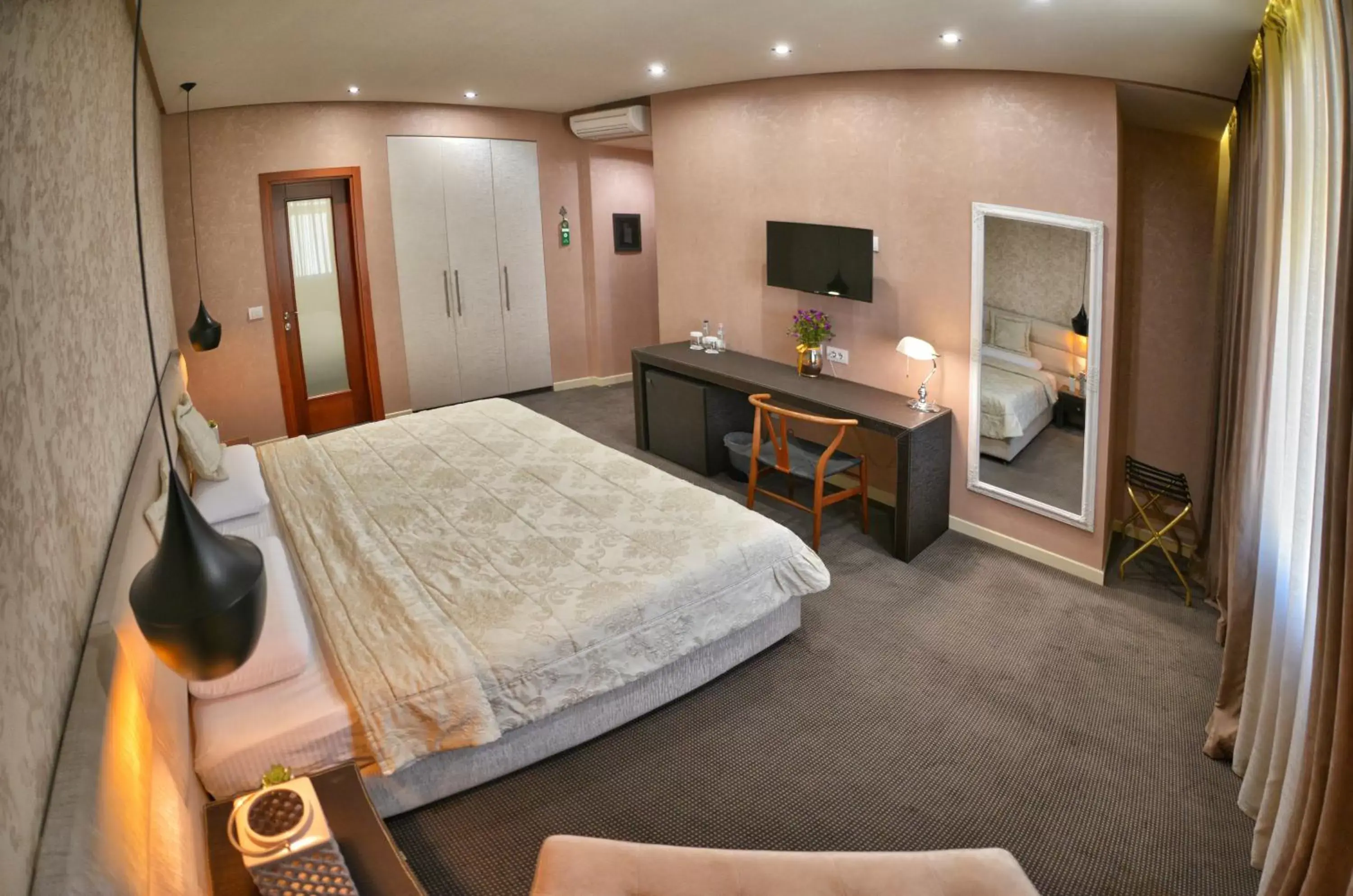 Bedroom in La Bohème Hotel