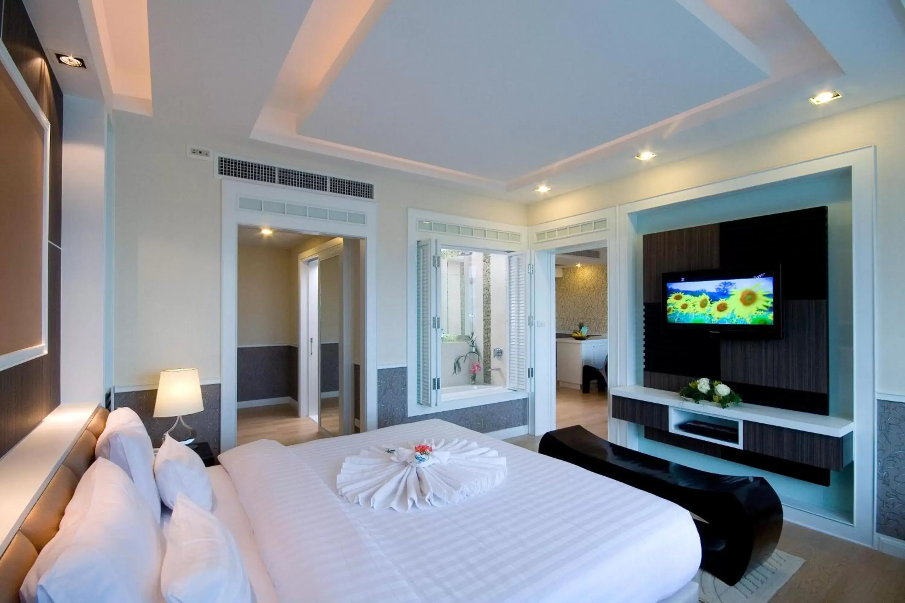 Photo of the whole room, TV/Entertainment Center in A-Te Chumphon Hotel - SHA Plus