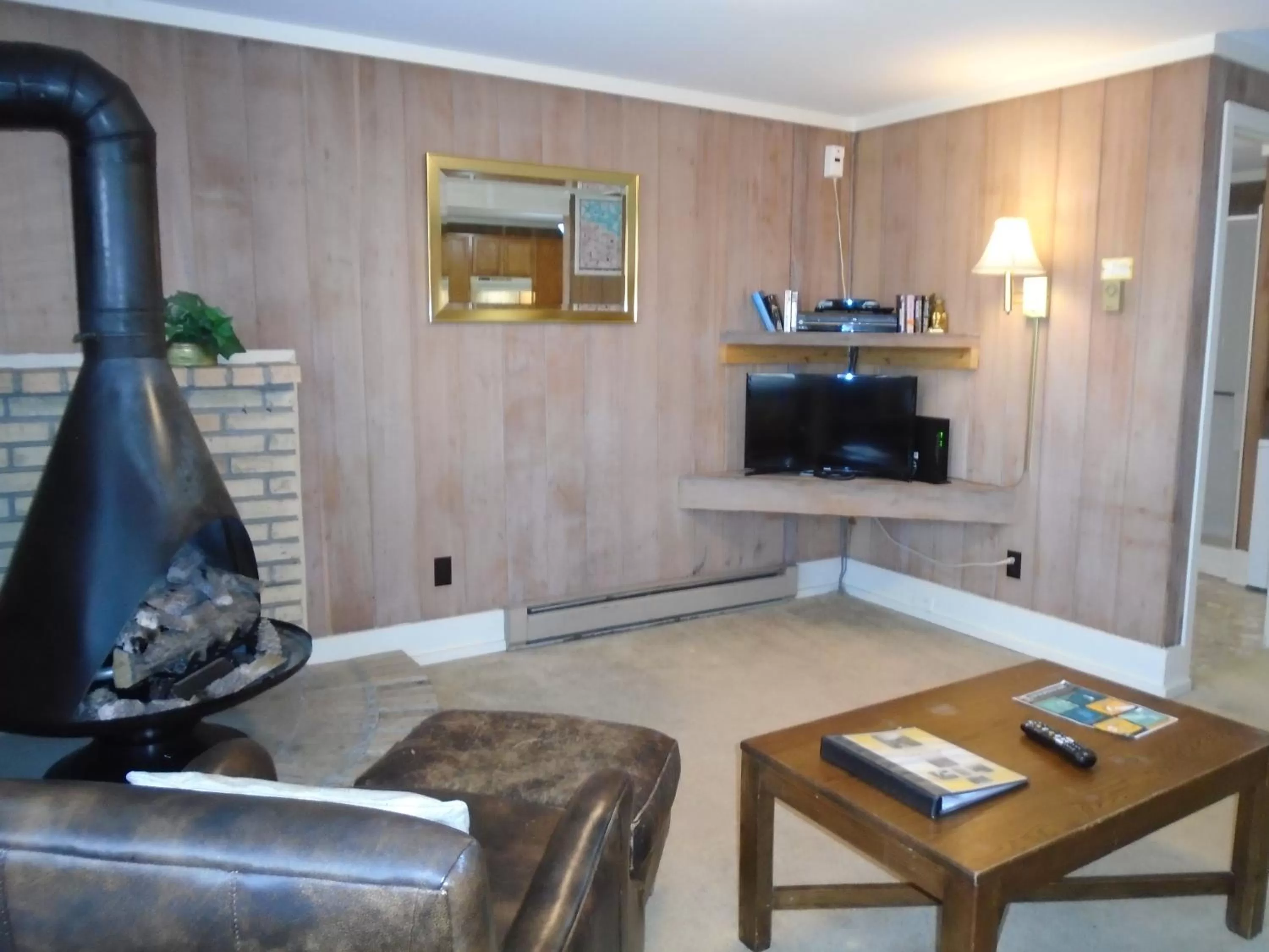 Living room, TV/Entertainment Center in Cedar Village Condominiums