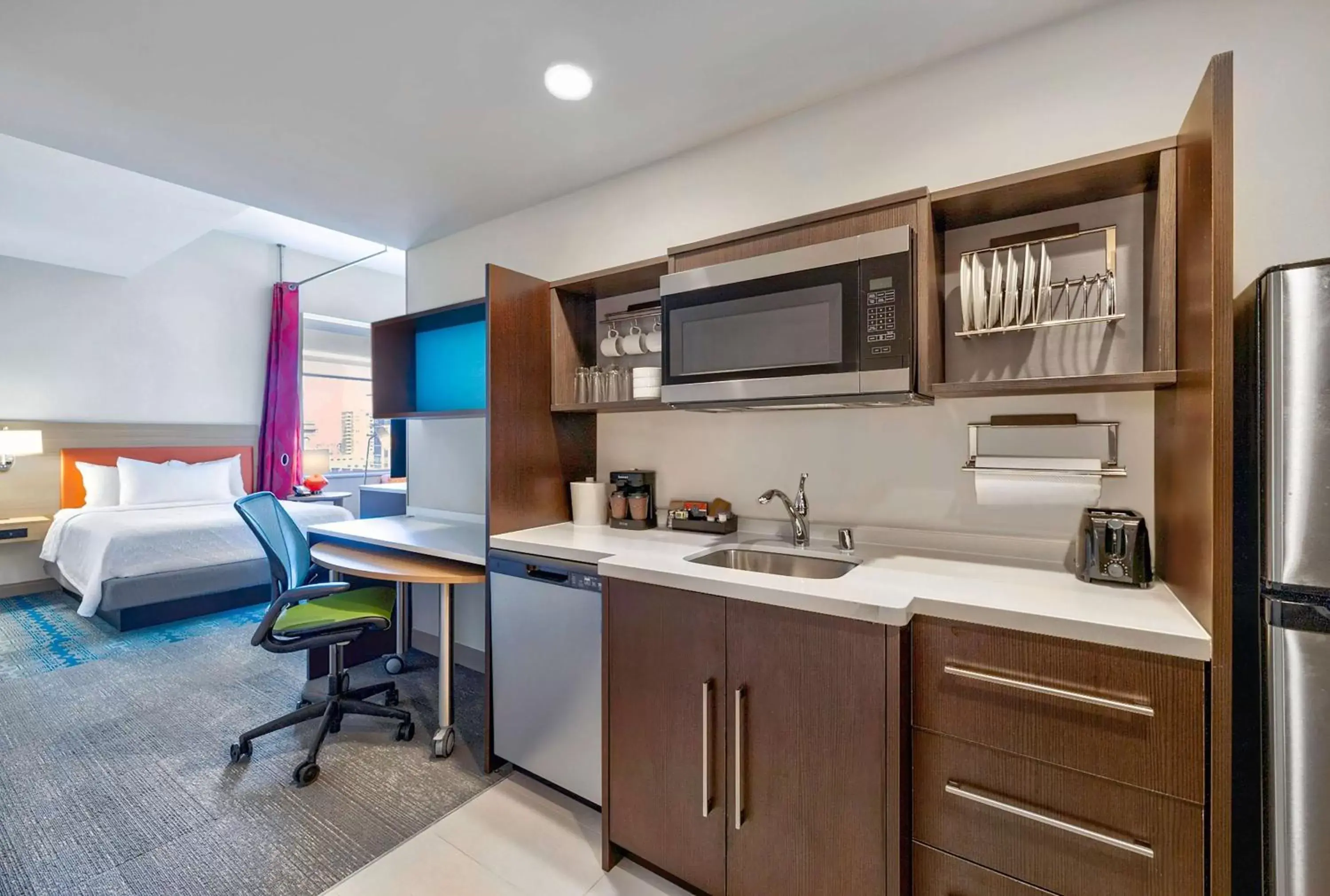 Bedroom, Kitchen/Kitchenette in Home2 Suites by Hilton Minneapolis Downtown