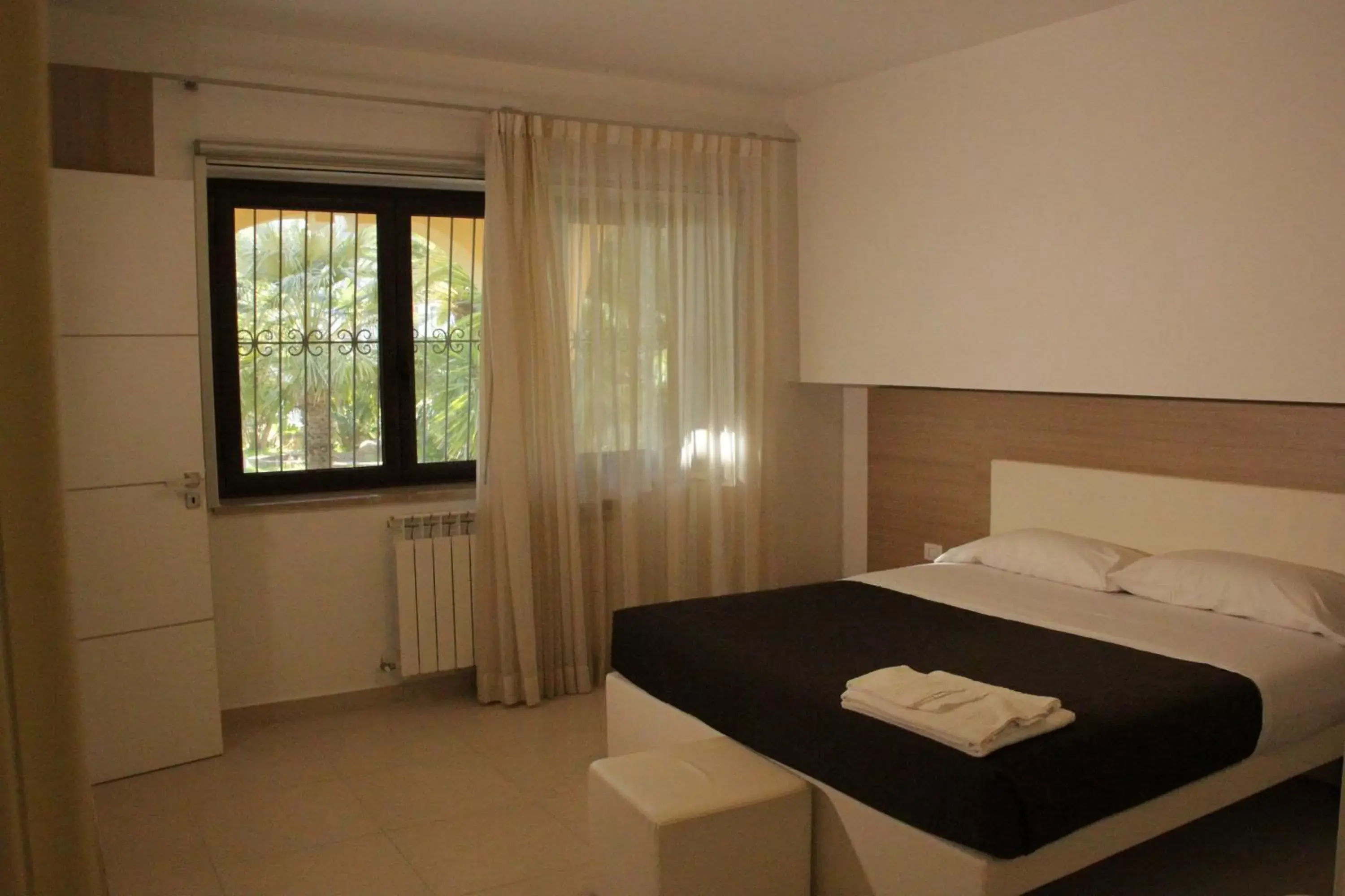 Bed in San Michele Apartments&Rooms