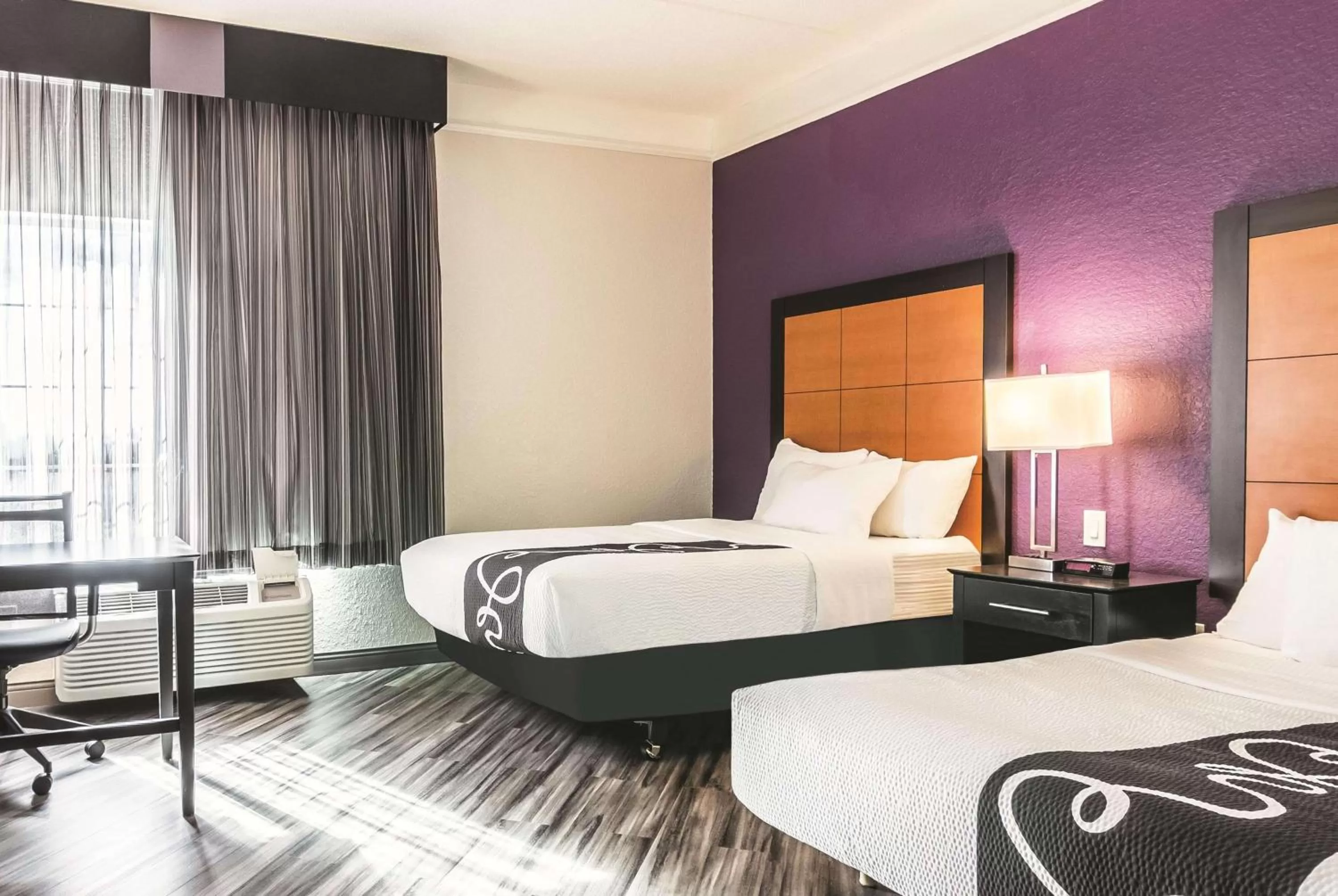 Photo of the whole room, Bed in La Quinta by Wyndham Orlando Airport North - Free Airport Shuttle!