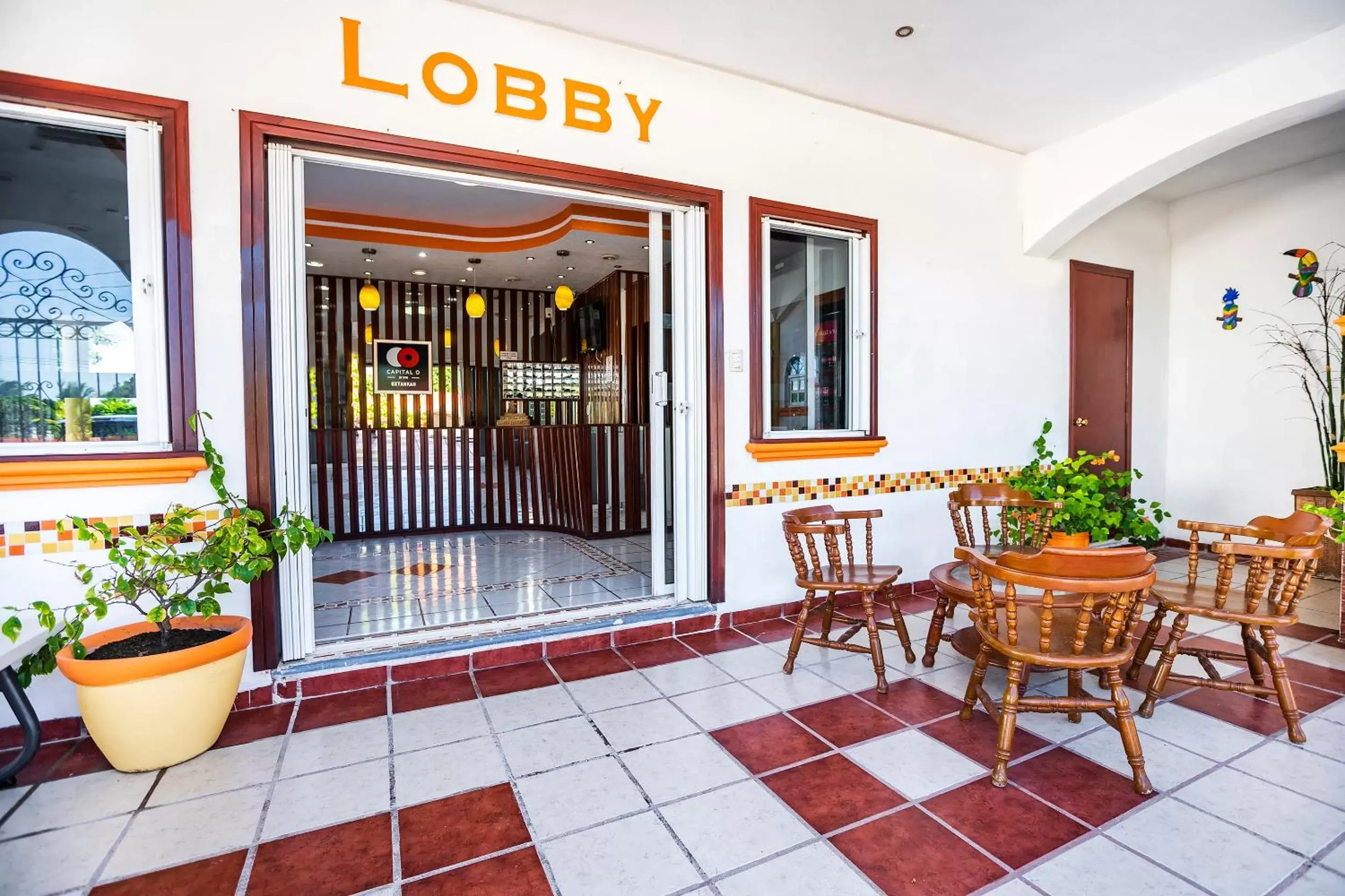 Lobby or reception in Capital O Oxtankah,chetumal bay