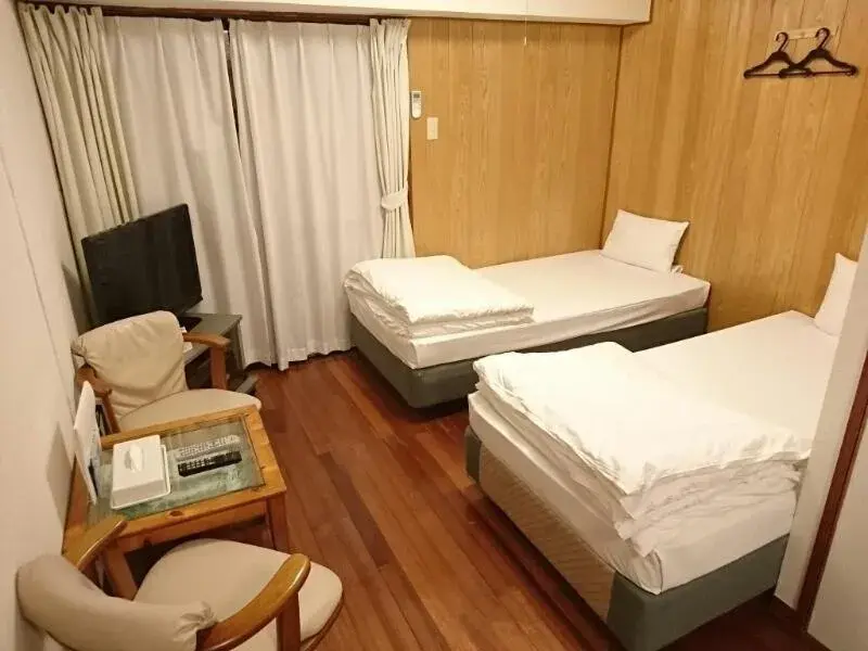 Bed in Kokusai Towns Inn