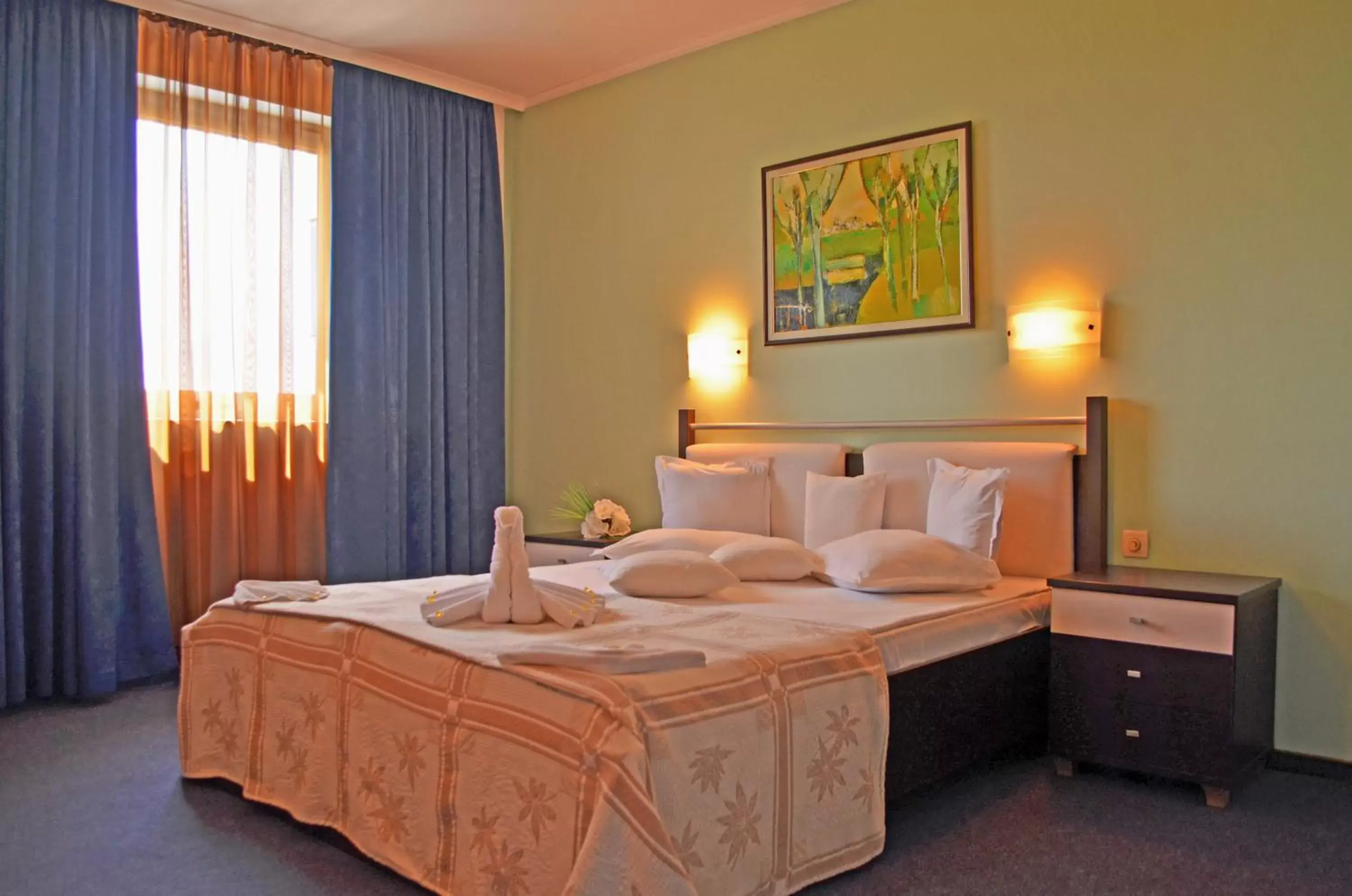 Bed, Room Photo in Aqua Hotel