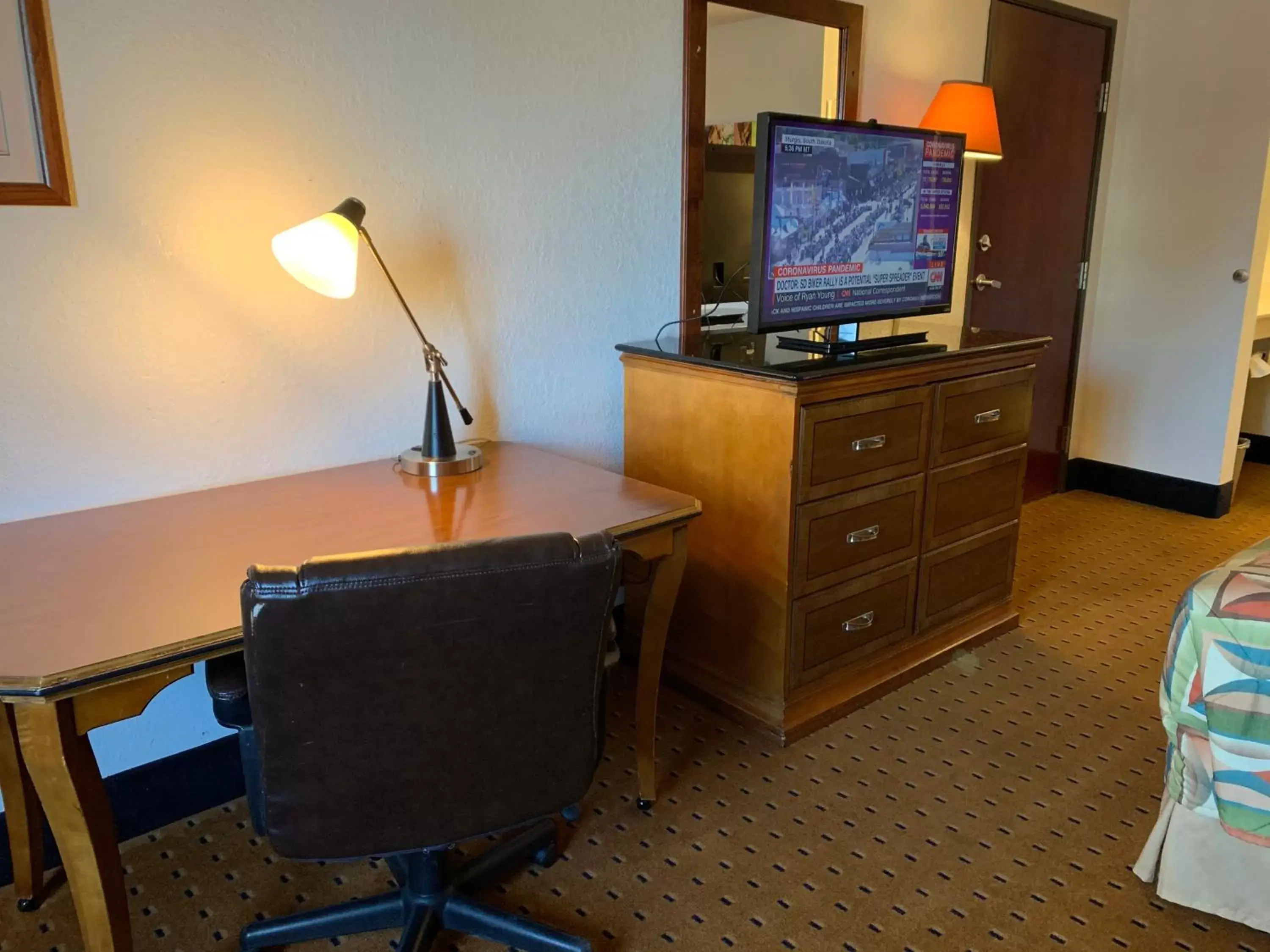 Photo of the whole room, TV/Entertainment Center in Brentwood Inn & Suites