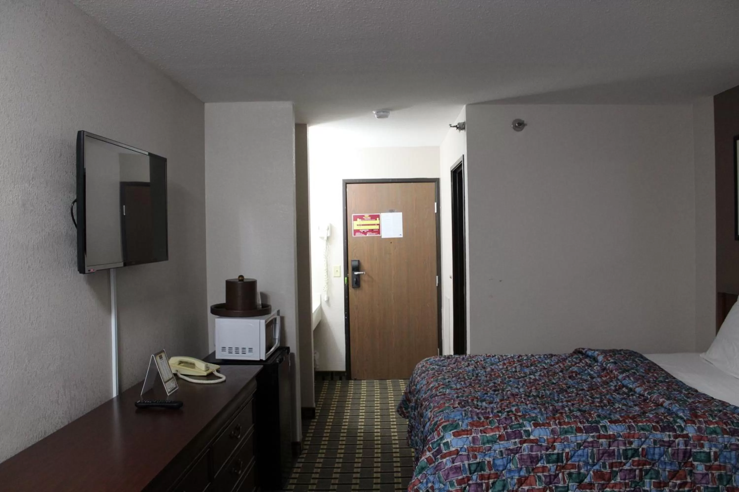 Bedroom, Bed in Coratel Inn and Suites Maple Grove