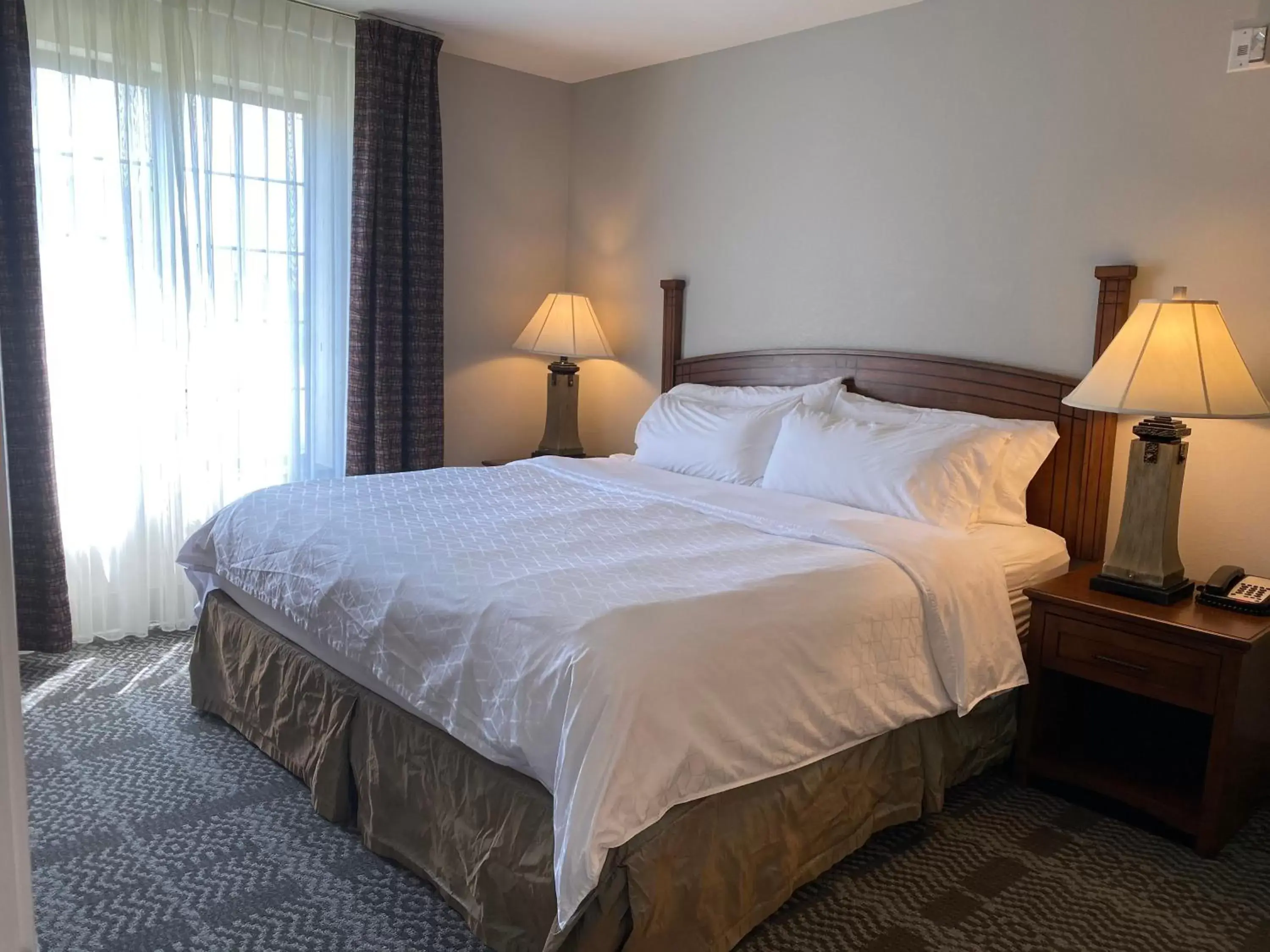 Photo of the whole room, Bed in Staybridge Suites Milwaukee West-Oconomowoc, an IHG Hotel