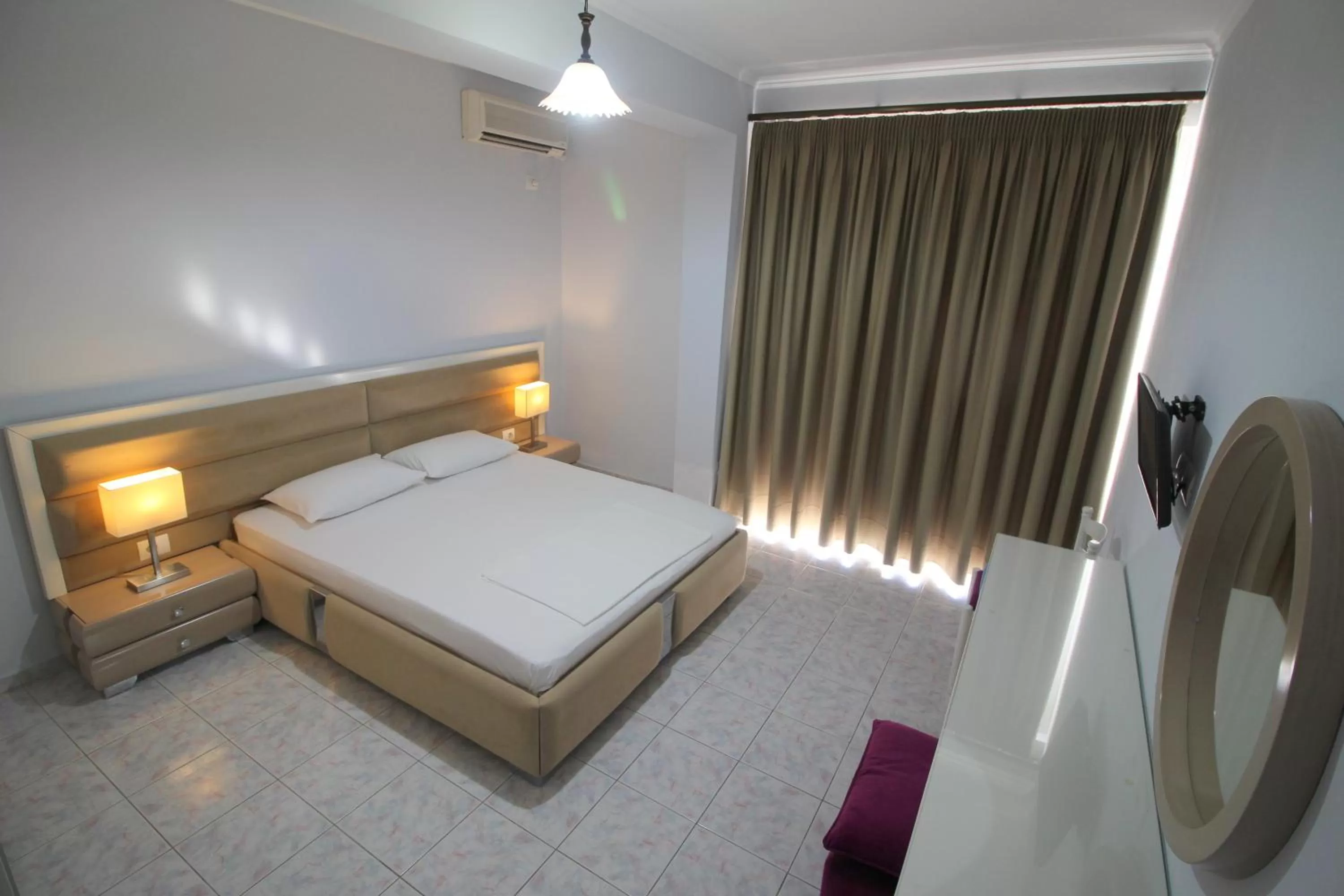 Bed in Murati Suites Sarandë