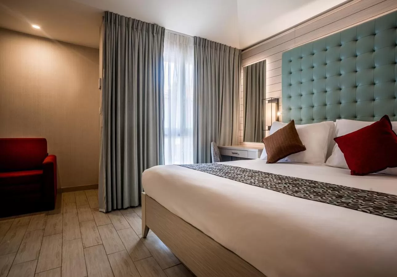 Bed in Astral Village Hotel