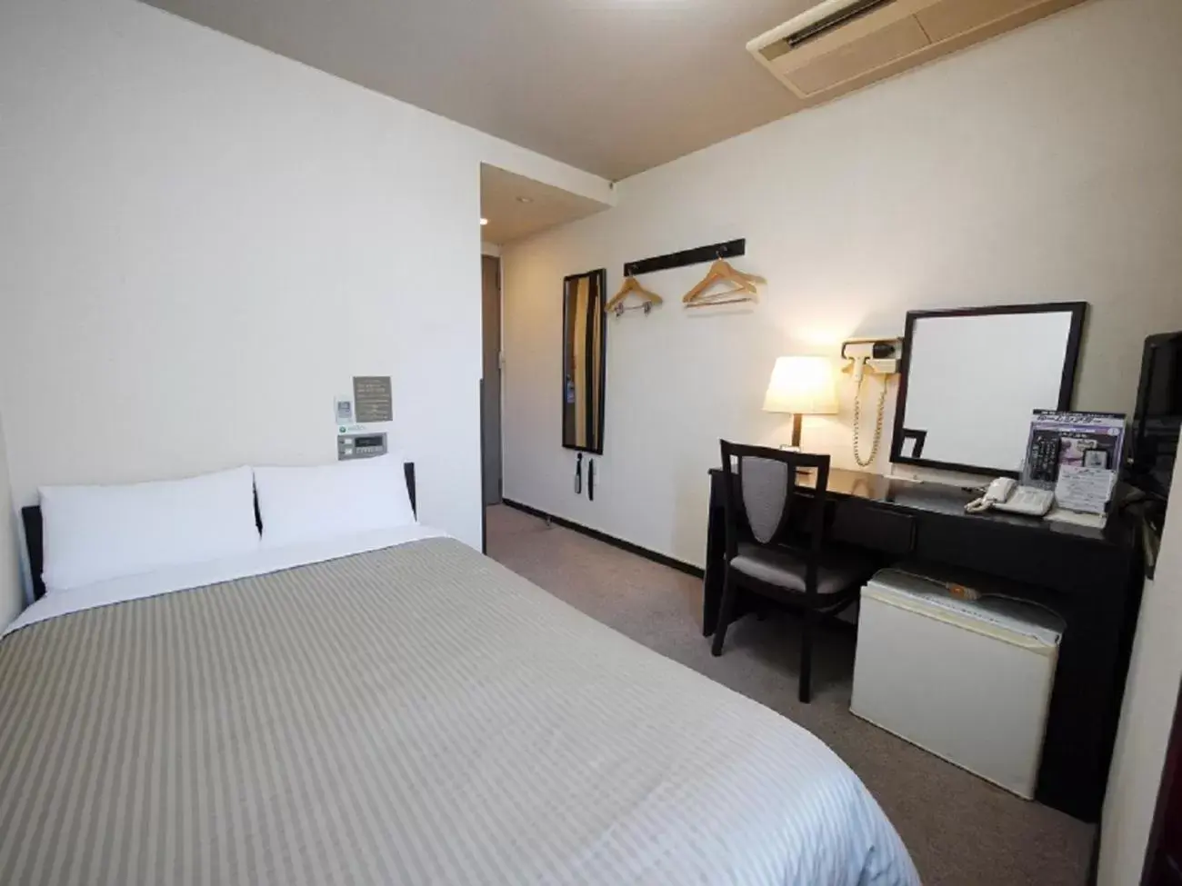 Photo of the whole room, Bed in Hotel Route-Inn Shimada Ekimae Photo of the whole room, Bed in Hotel Route-Inn Shimada Ekimae