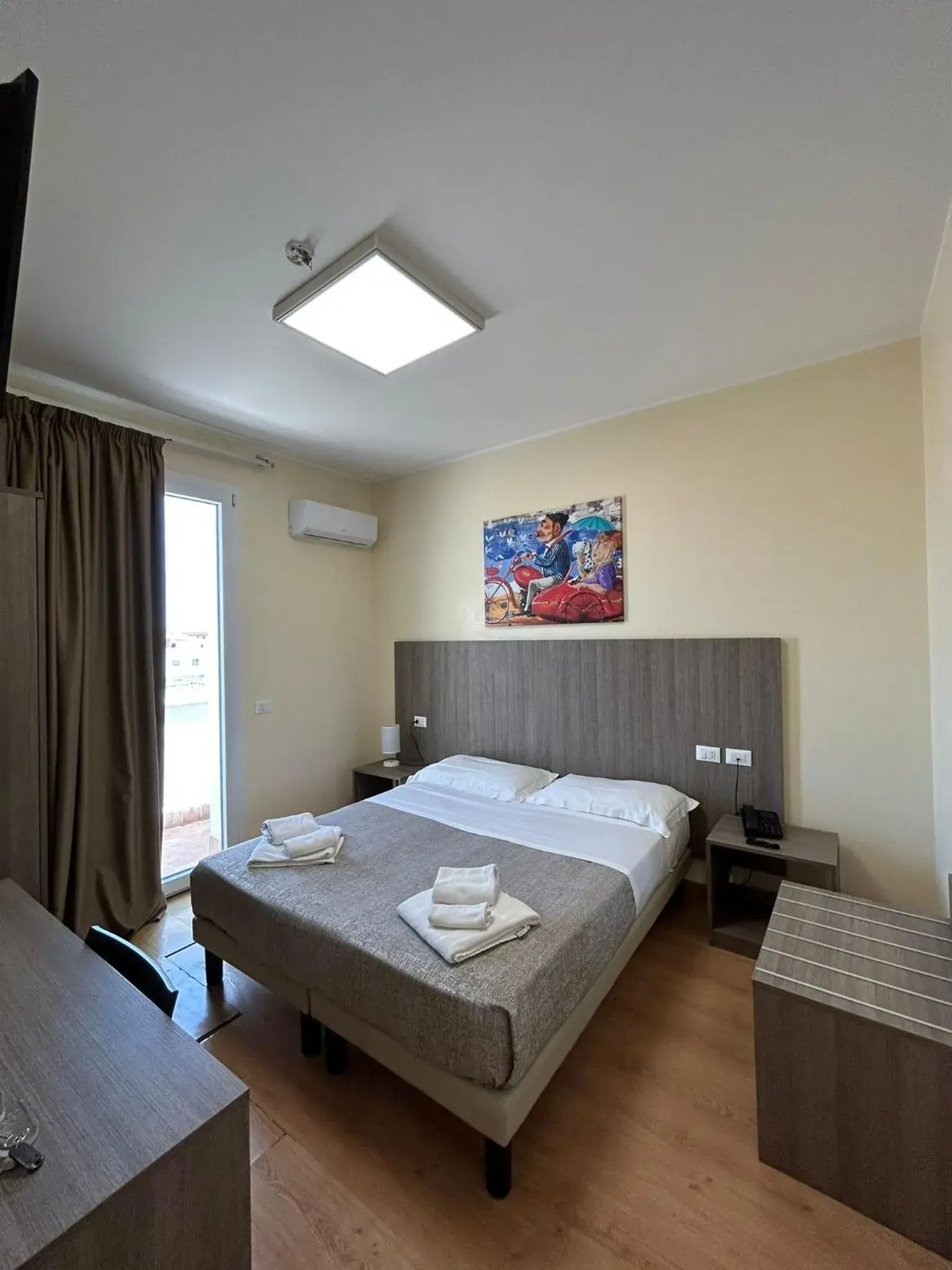 Bed in 55 Aira Hotel