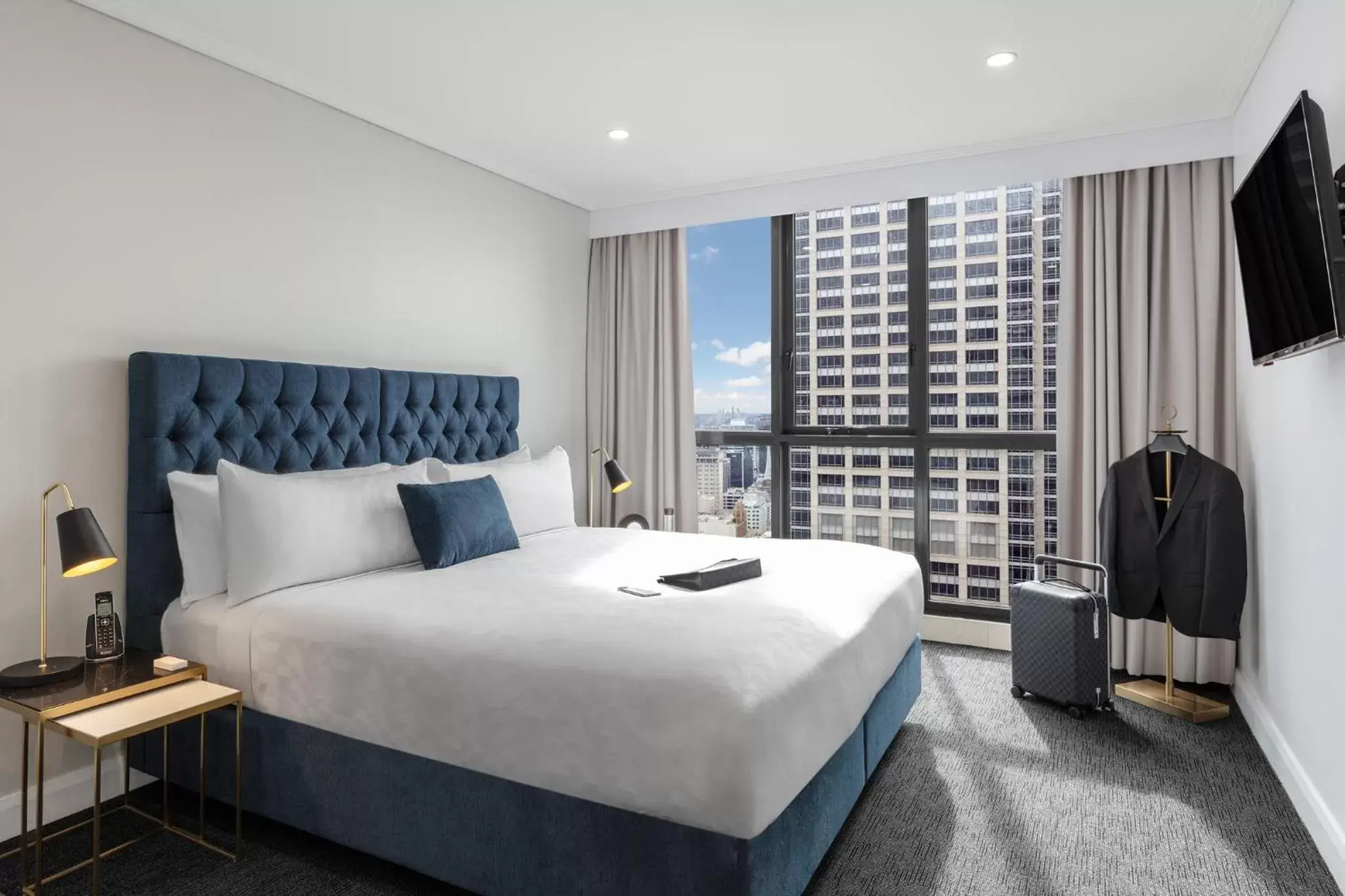 Bed in Meriton Suites Pitt Street, Sydney