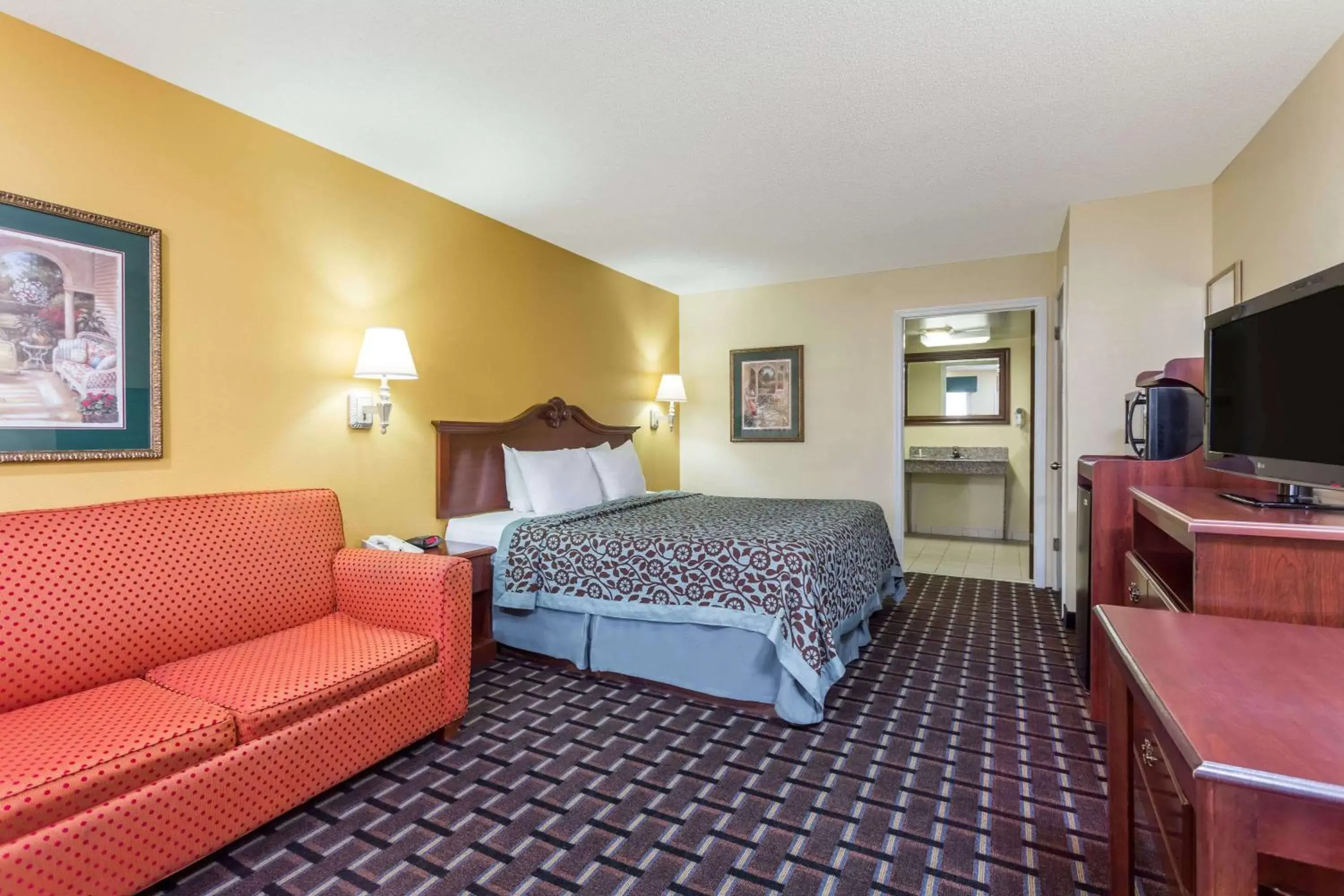 Photo of the whole room in Days Inn & Suites by Wyndham Warner Robins Near Robins AFB