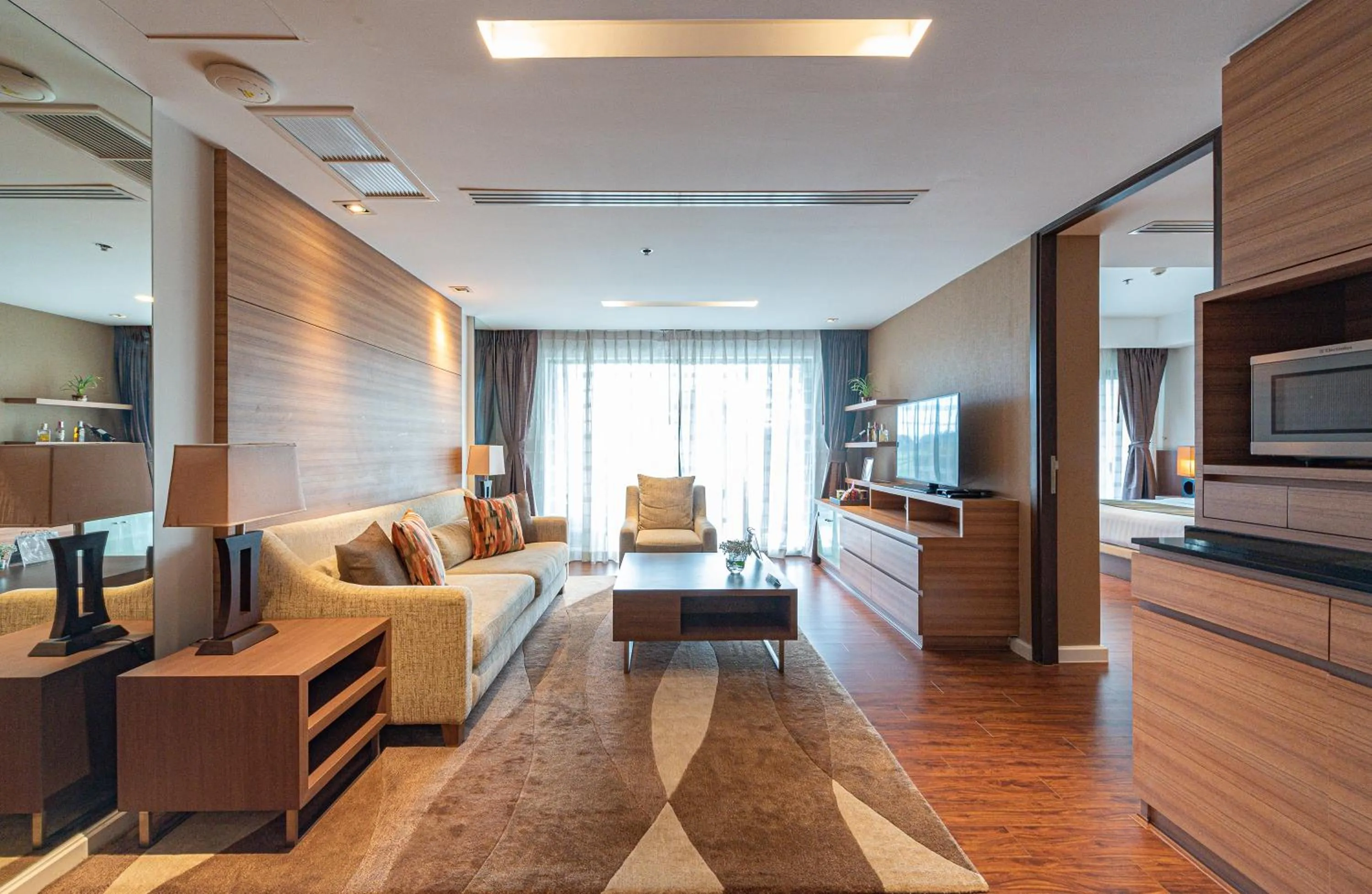 Living room in Summit Windmill Golf Suite Hotel at Suvarnabhumi