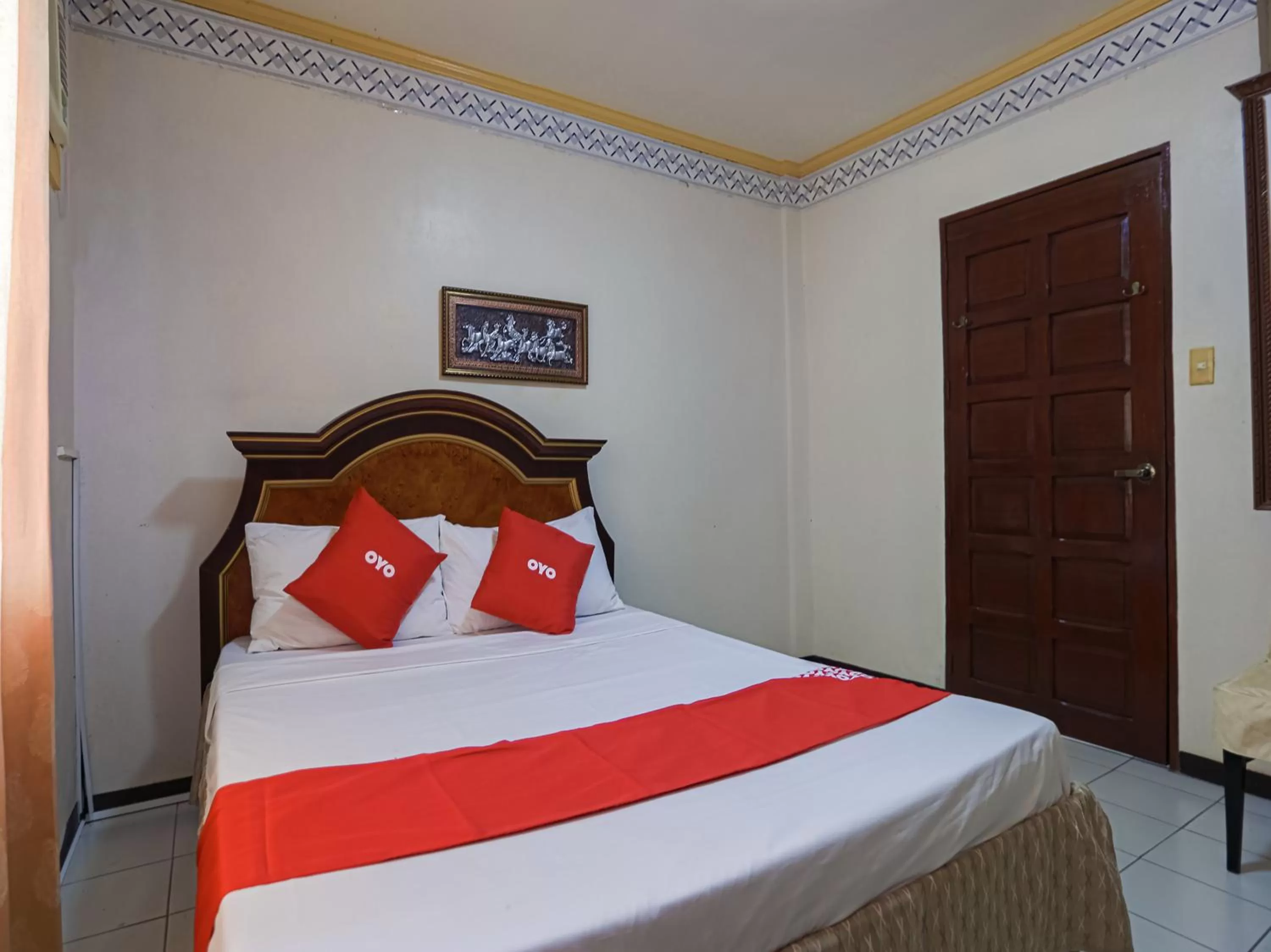 Bedroom in OYO 784 Laura's Garden Resort