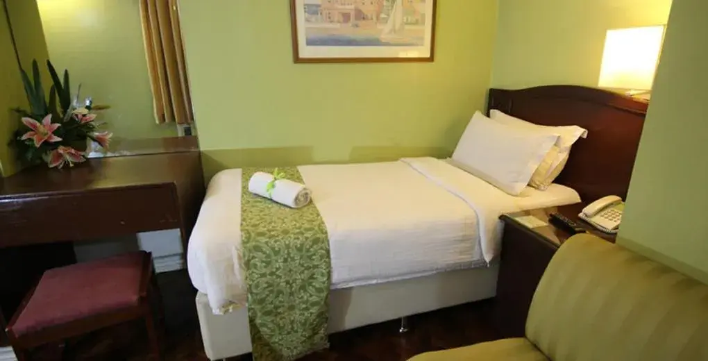 Bed in The Corporate Inn Hotel