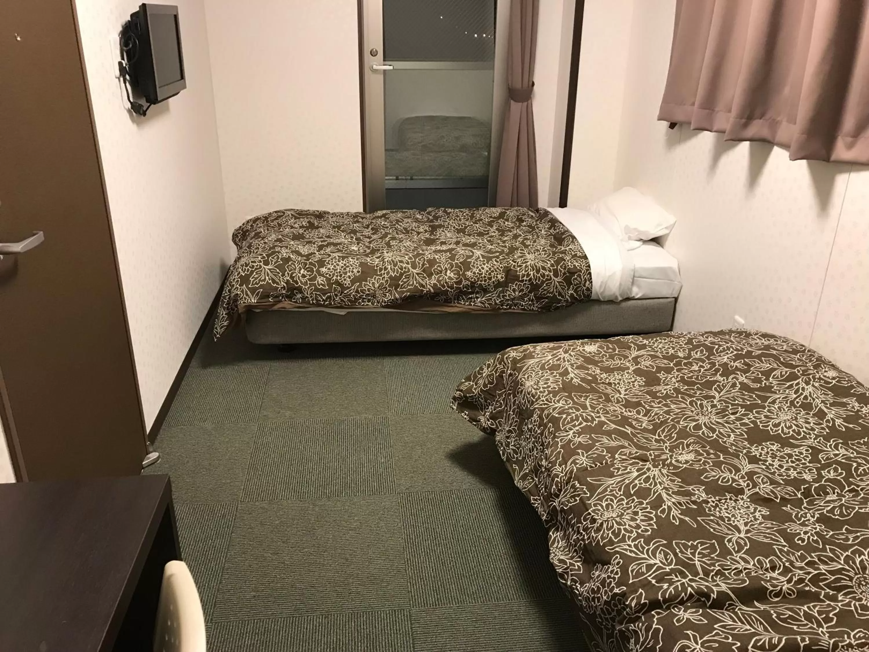 Bed in Hotel Famitic Nikko Station